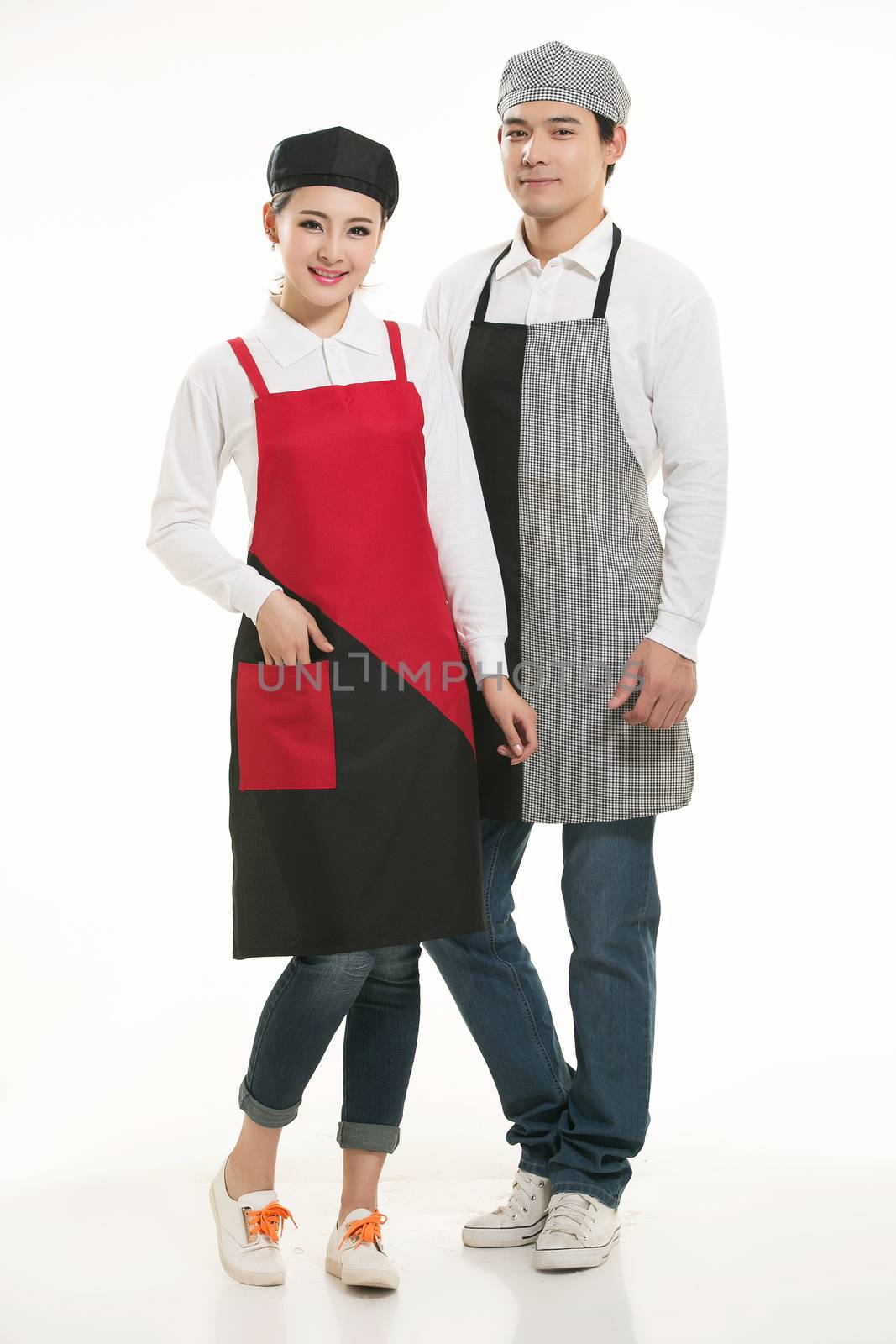 Wear all kinds of T-shirts waiter standing in white background by quweichang