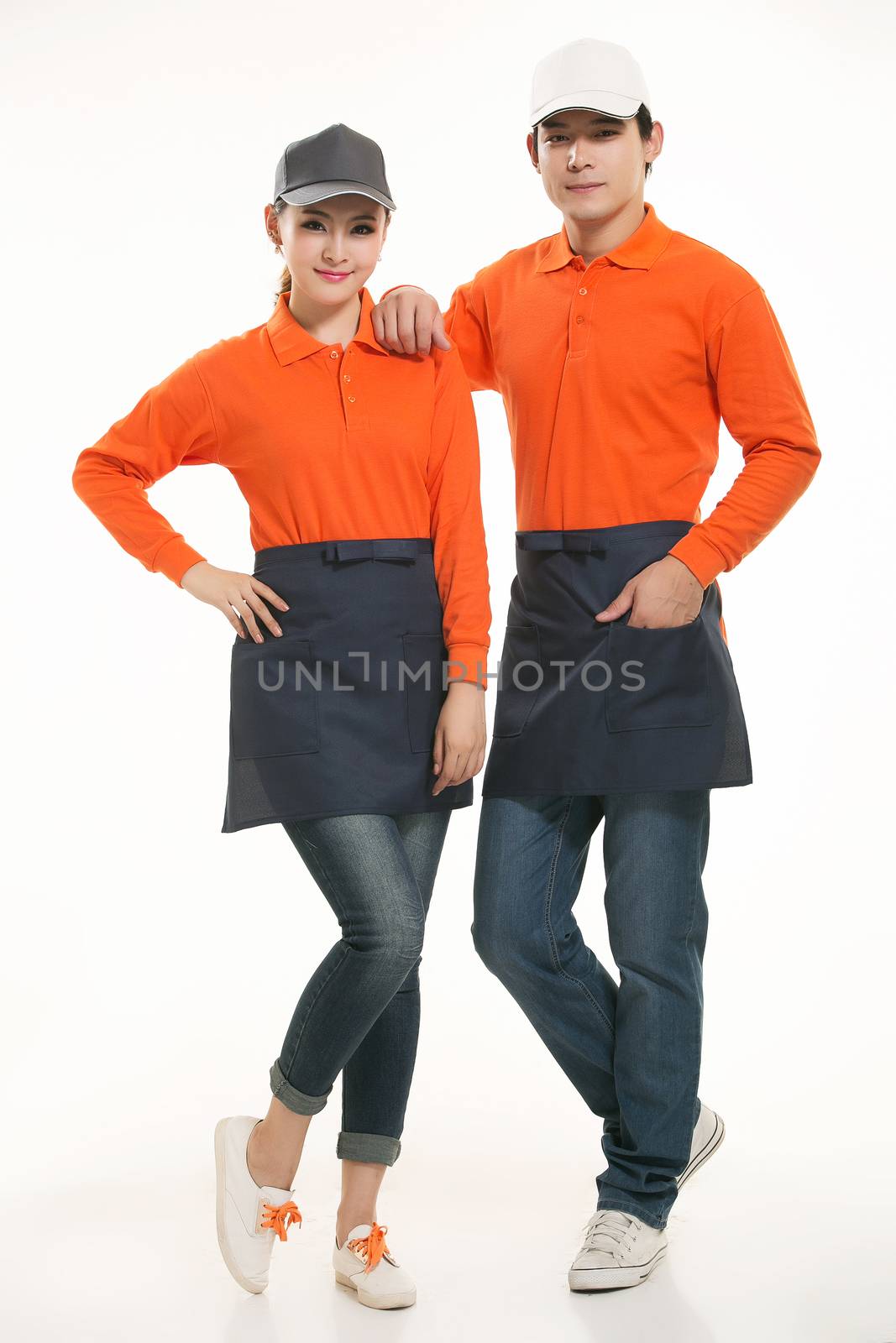 Wear all kinds of T-shirts waiter standing in white background by quweichang