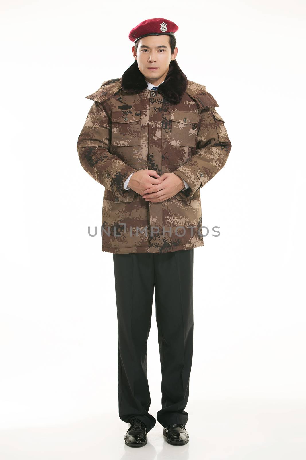 Create all kinds of work clothes policeman stands in front of a white background by quweichang