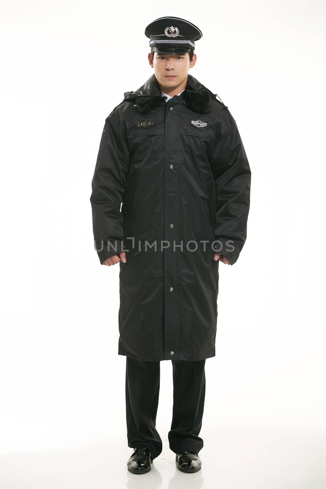 Create all kinds of work clothes policeman stands in front of a white background by quweichang