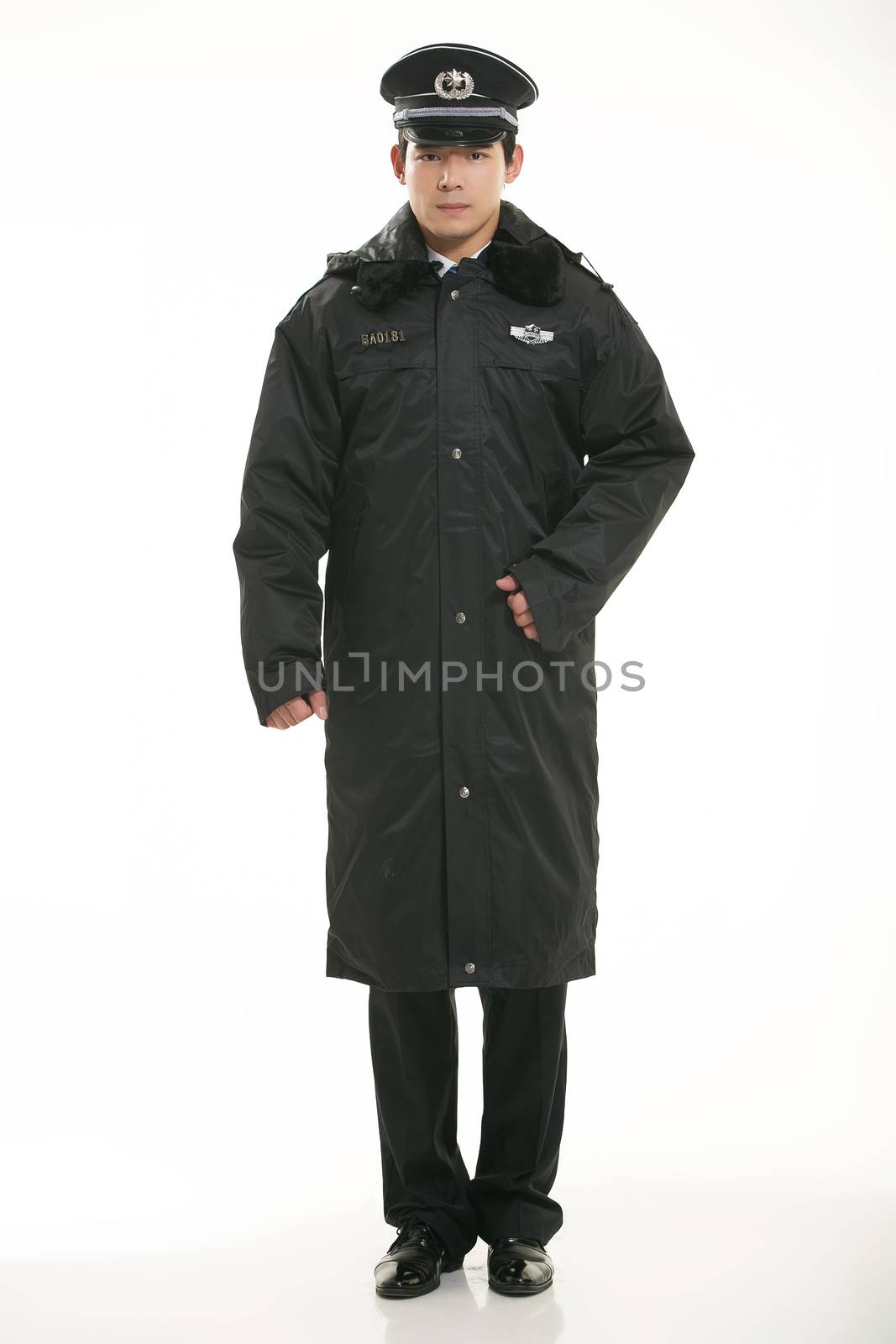 Create all kinds of work clothes policeman stands in front of a white background by quweichang