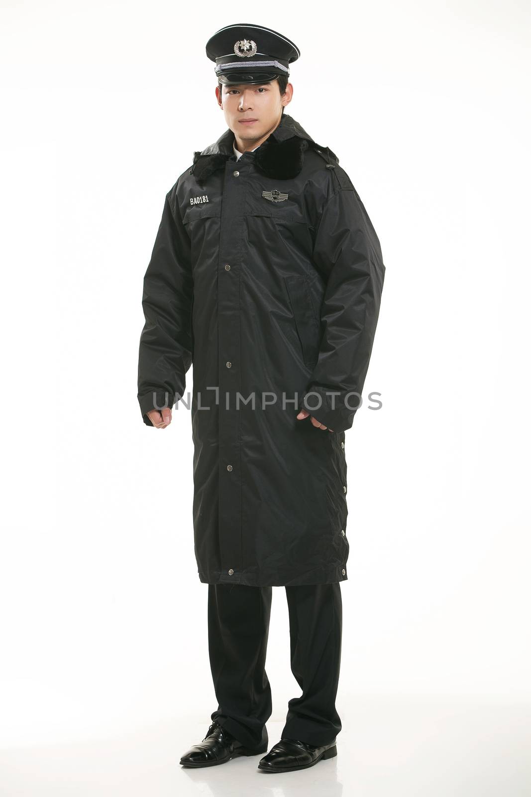 Create all kinds of work clothes policeman stands in front of a white background