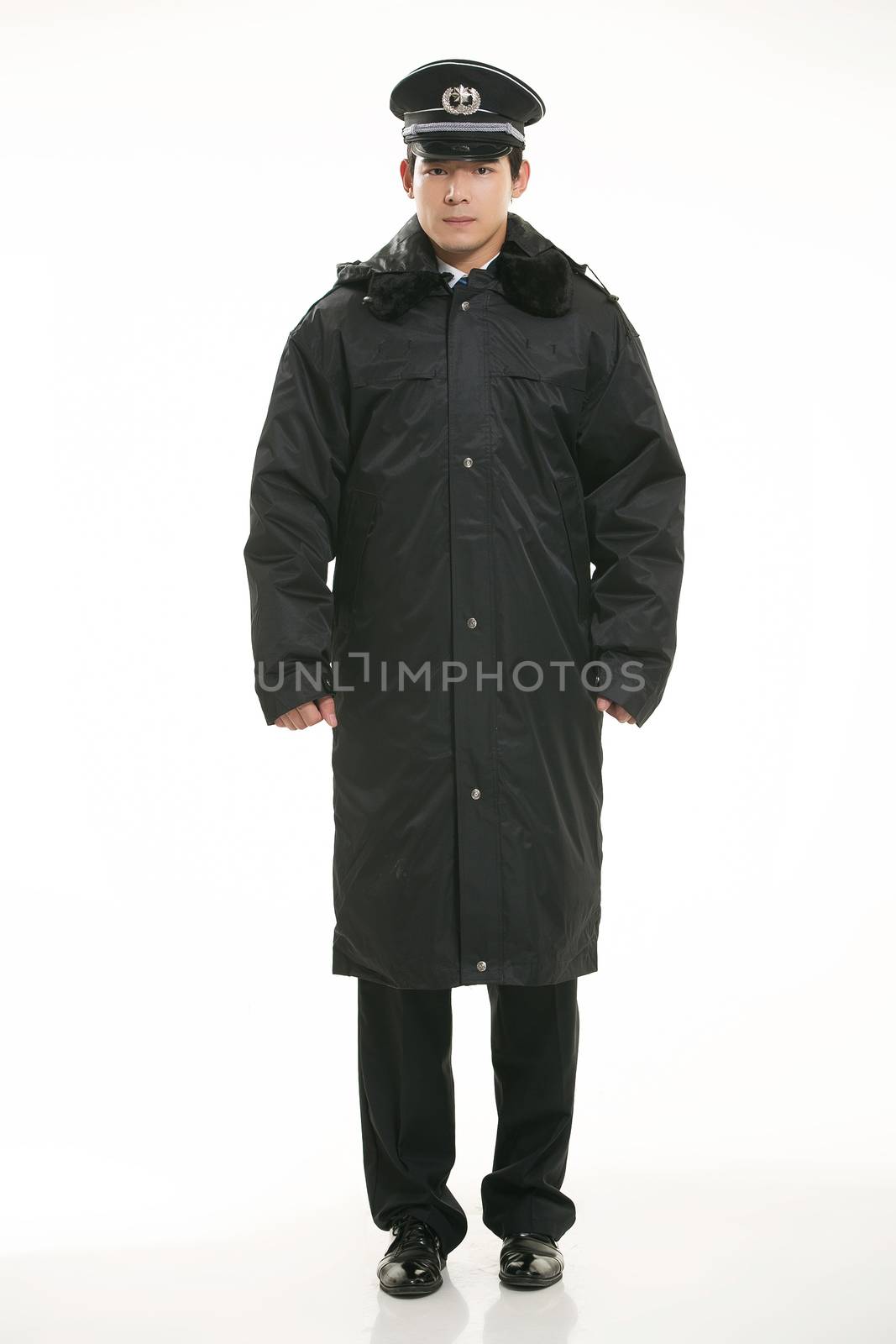 Create all kinds of work clothes policeman stands in front of a white background by quweichang