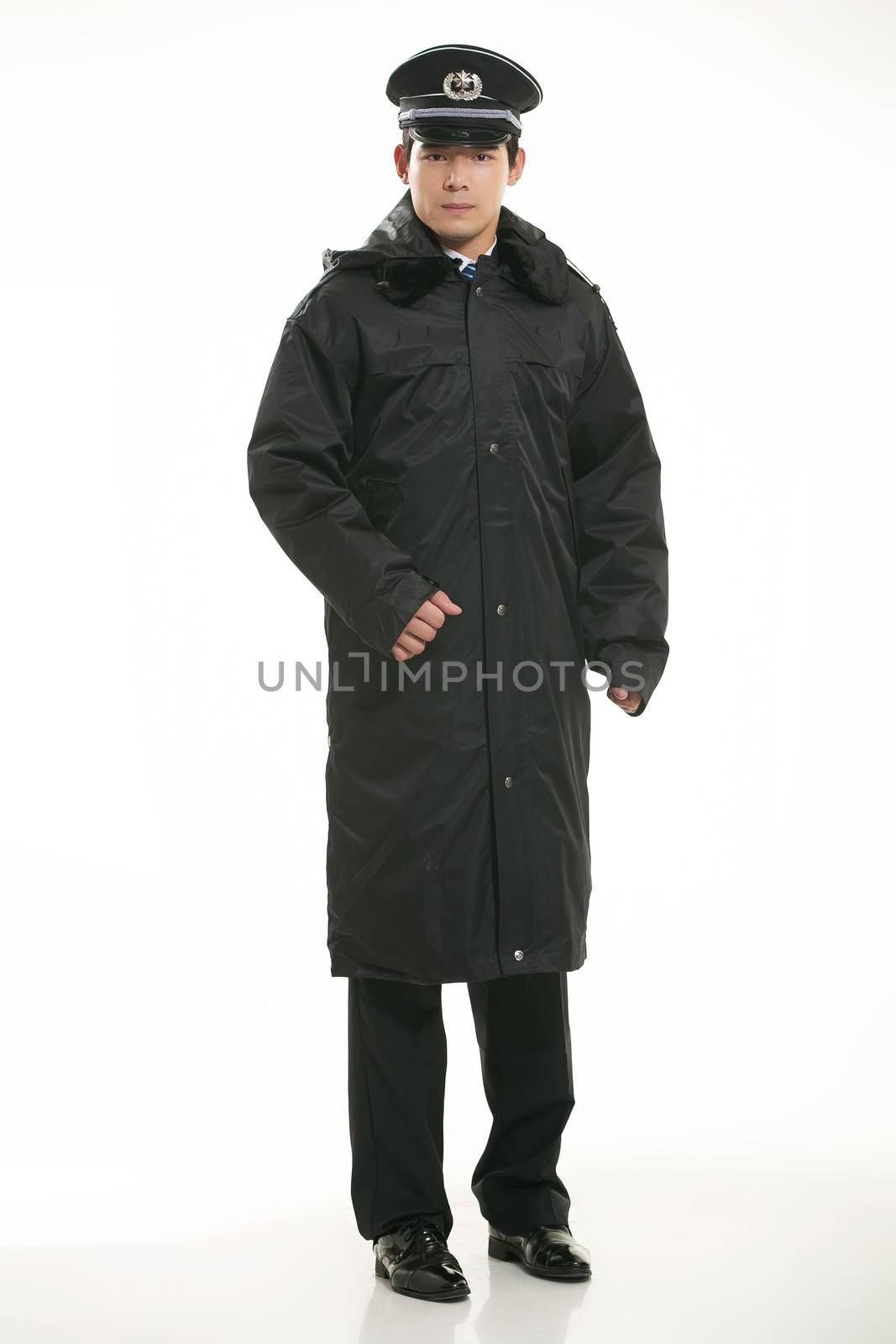 Create all kinds of work clothes policeman stands in front of a white background by quweichang