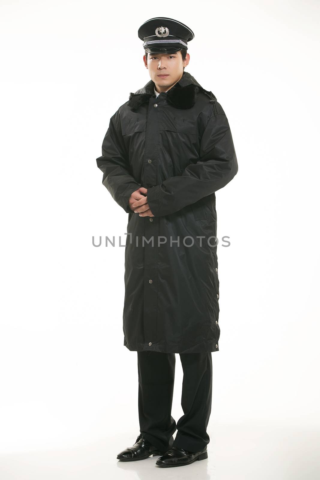 Create all kinds of work clothes policeman stands in front of a white background