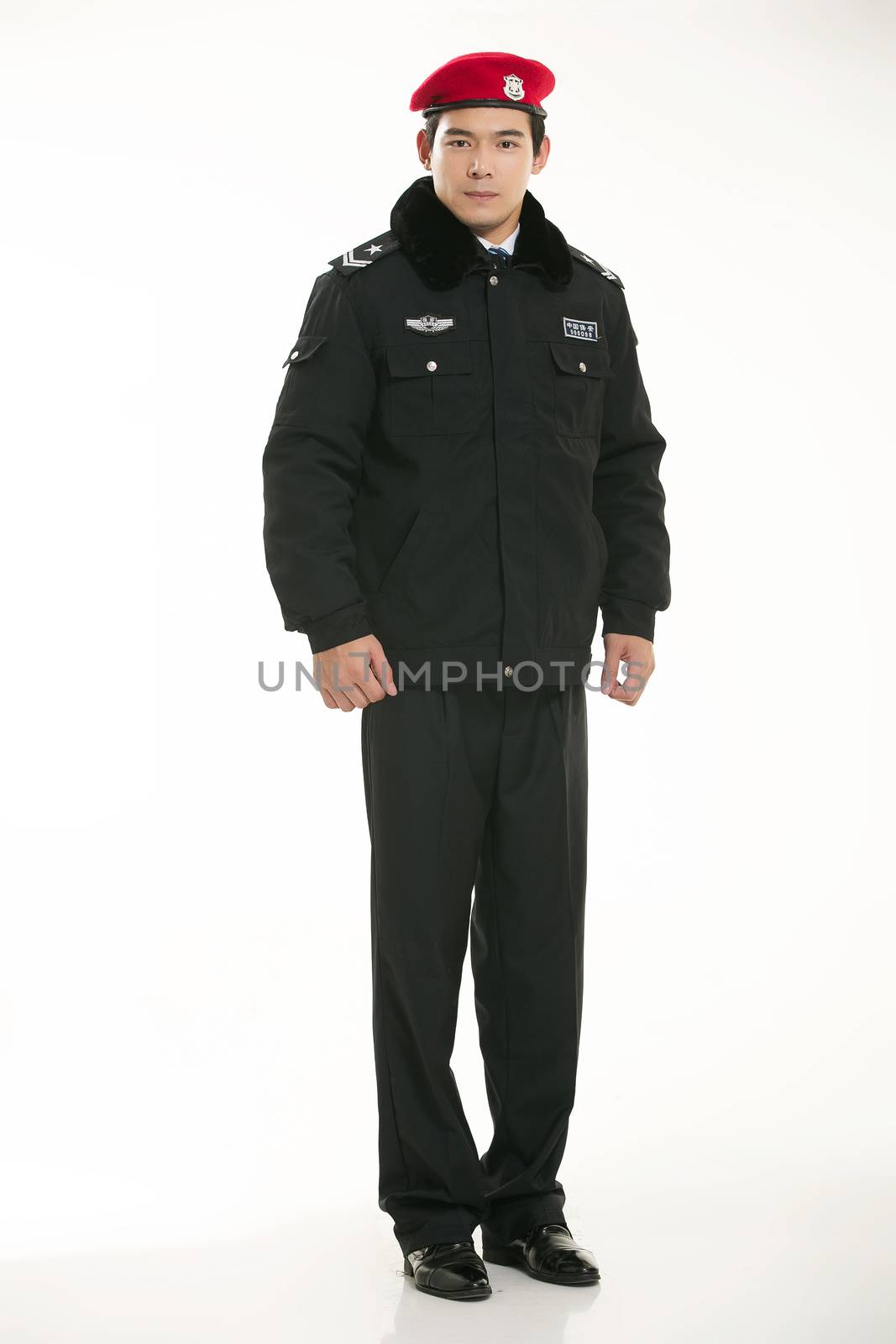 Create all kinds of work clothes policeman stands in front of a white background by quweichang