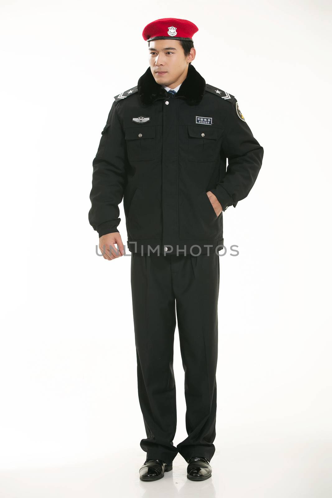 Create all kinds of work clothes policeman stands in front of a white background