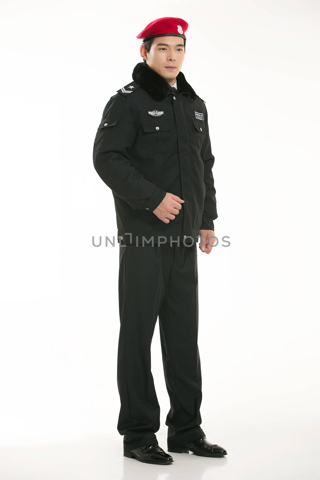 Create all kinds of work clothes policeman stands in front of a white background