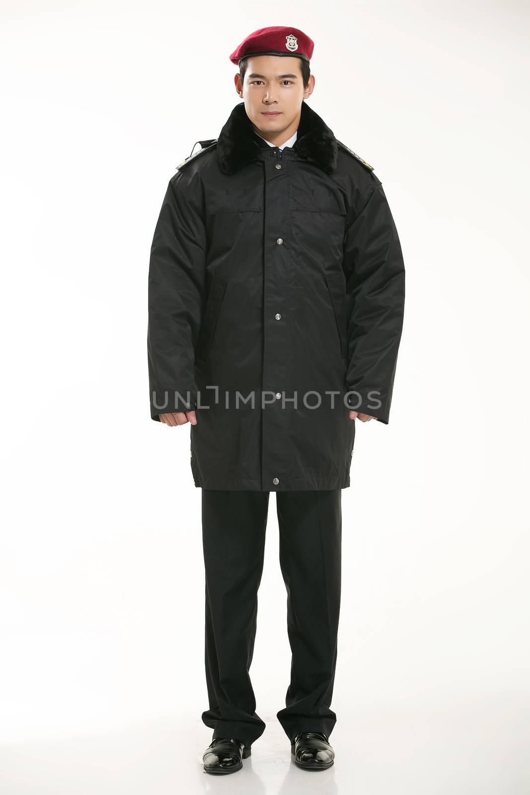 Create all kinds of work clothes policeman stands in front of a white background