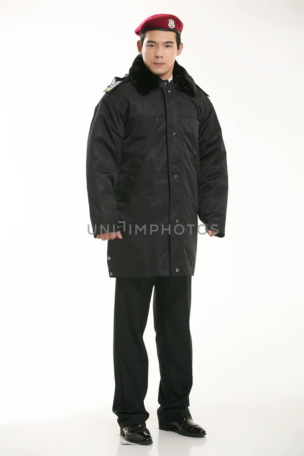 Create all kinds of work clothes policeman stands in front of a white background by quweichang