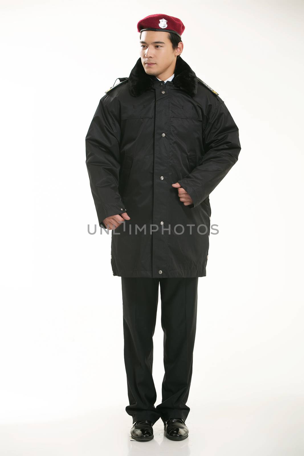 Create all kinds of work clothes policeman stands in front of a white background by quweichang