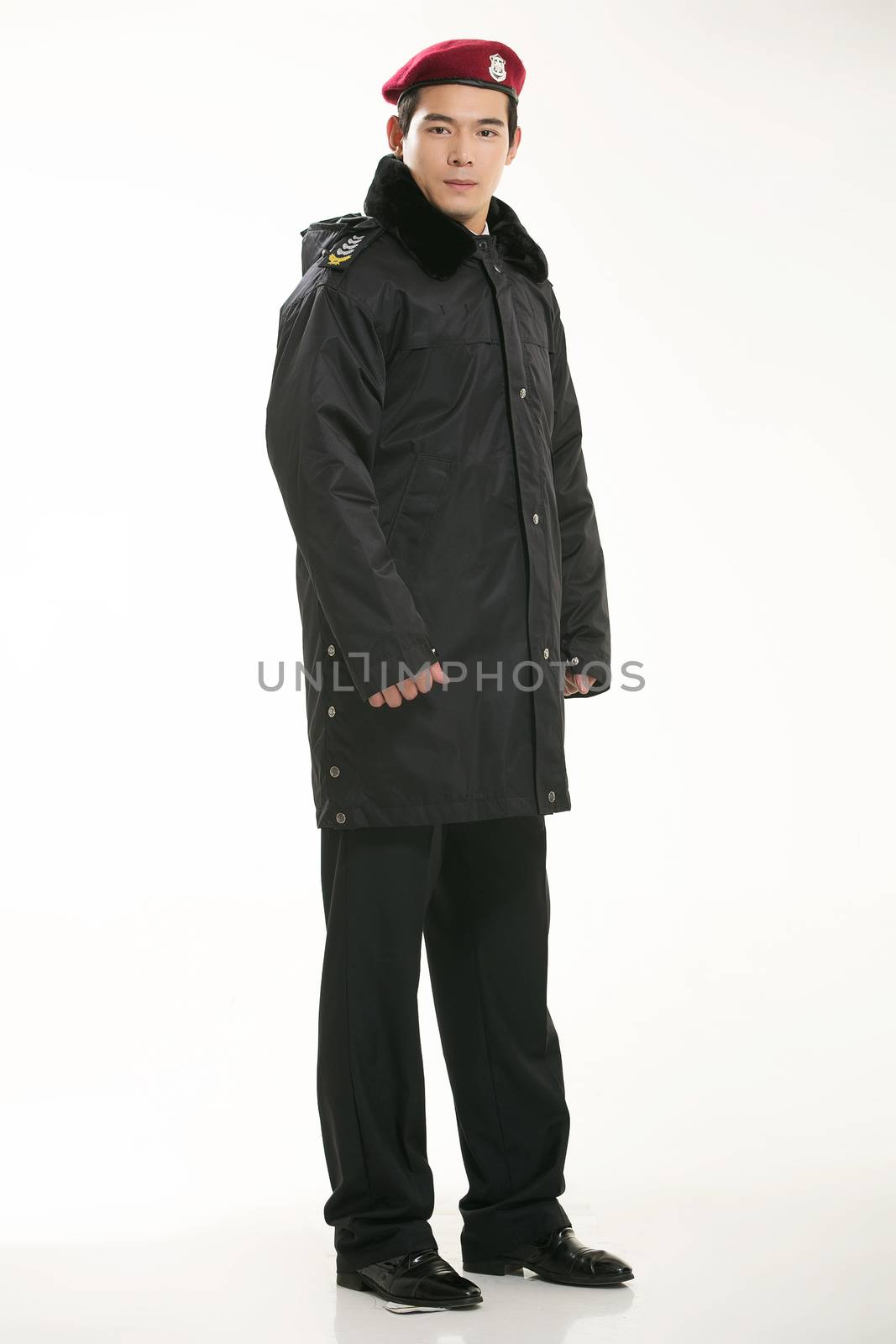 Create all kinds of work clothes policeman stands in front of a white background