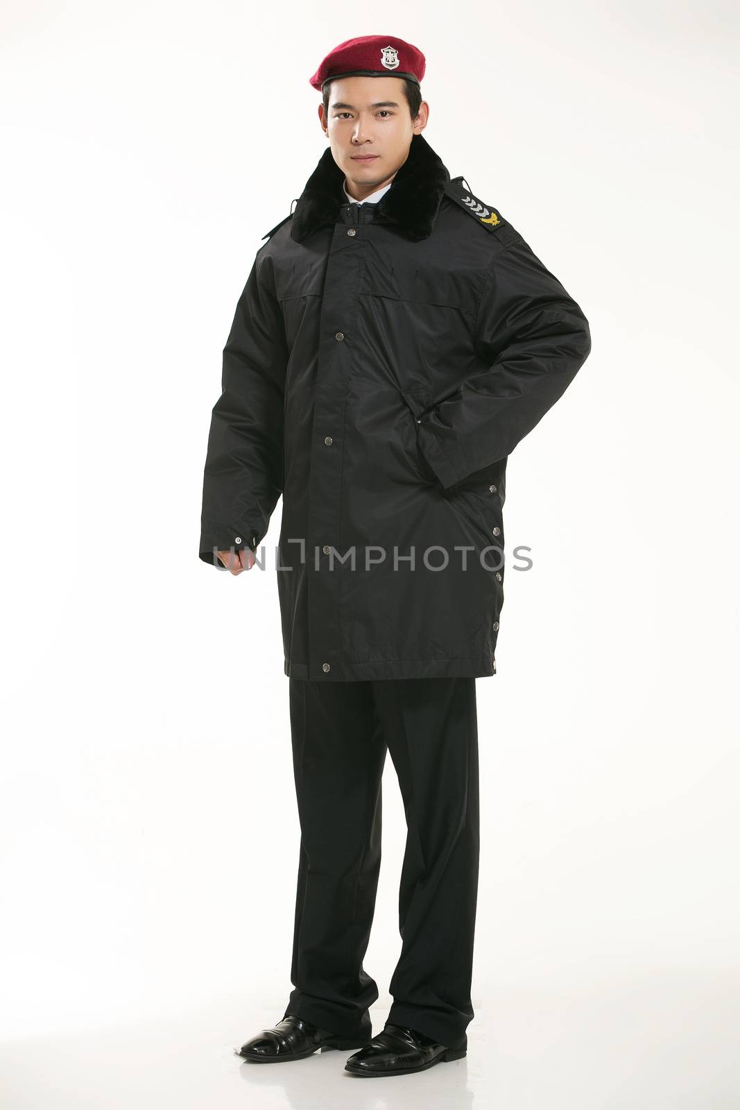 Create all kinds of work clothes policeman stands in front of a white background