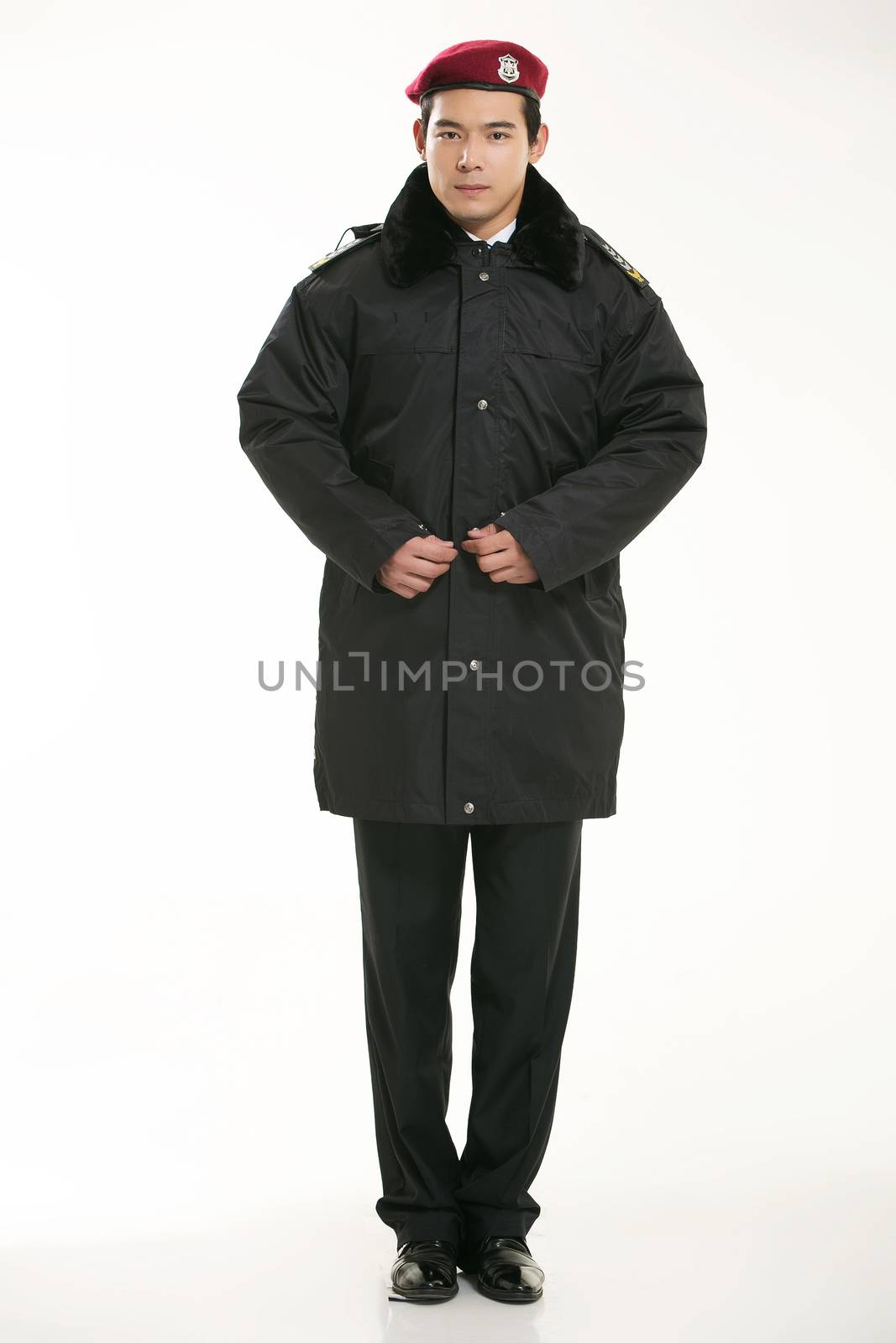 Create all kinds of work clothes policeman stands in front of a white background