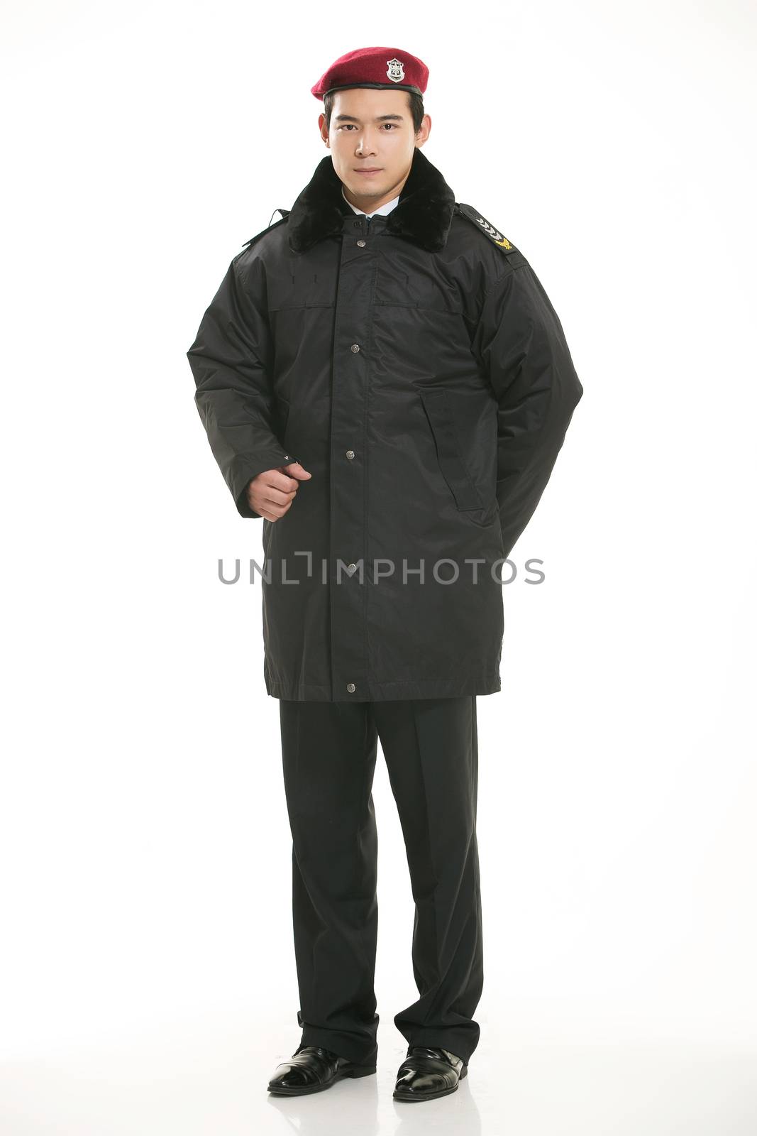 Create all kinds of work clothes policeman stands in front of a white background by quweichang