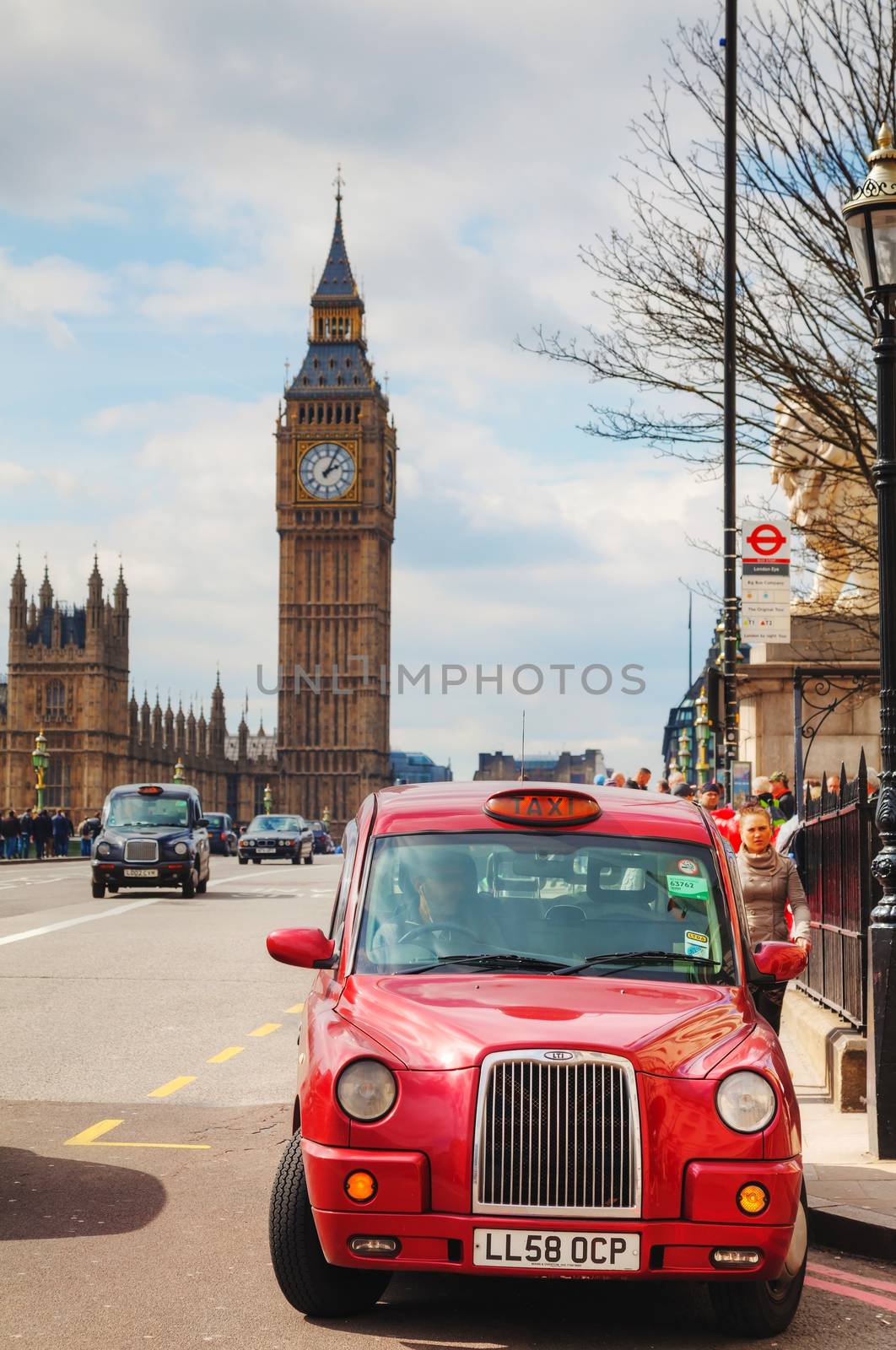 LONDON - APRIL 5: Famous taxi cab (hackney) on a street on April 5, 2015 in London, UK. A hackney or hackney carriage (a cab, black cab, hack or London taxi) is a carriage or automobile for hire.