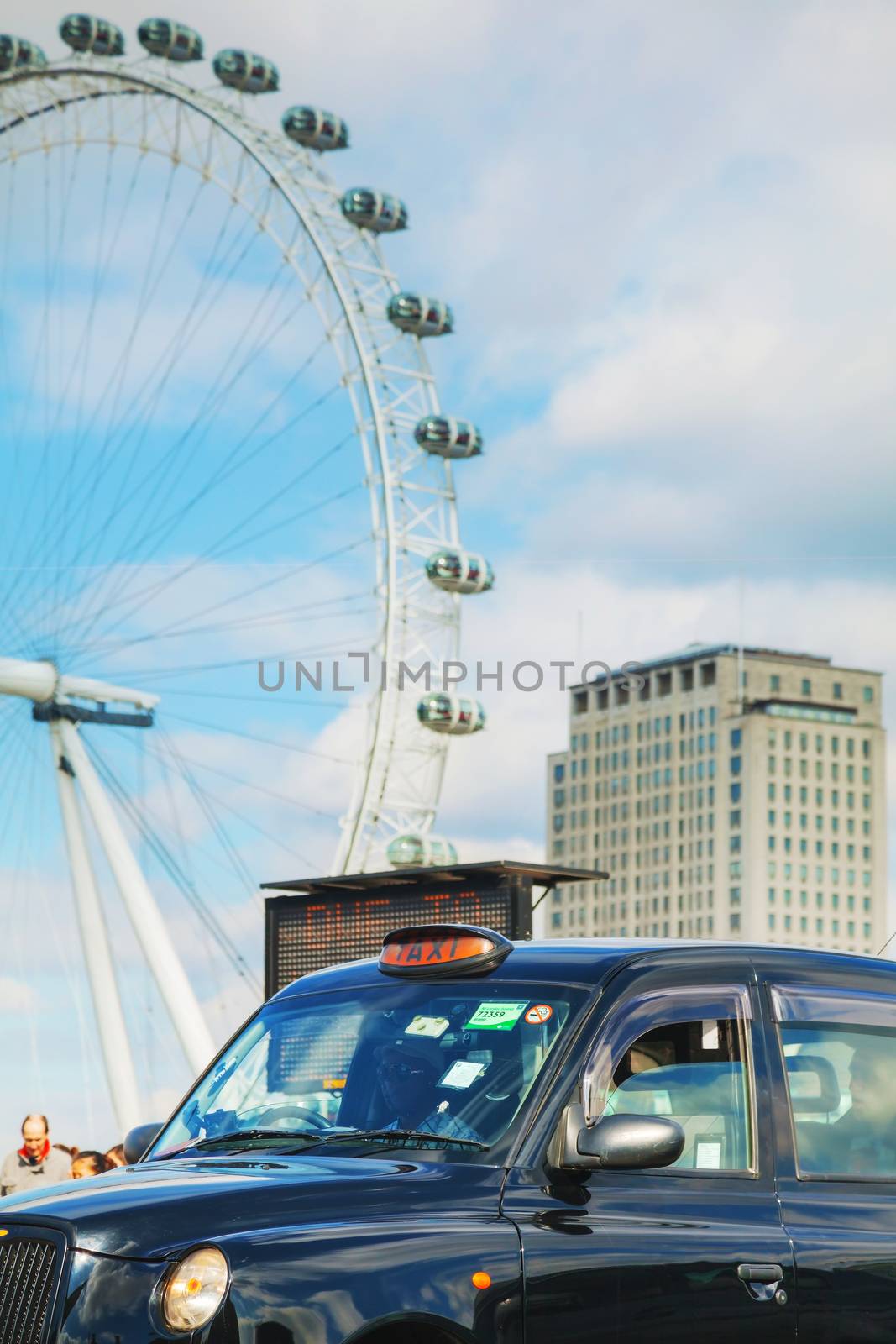 Famous black cab an a street in London by AndreyKr