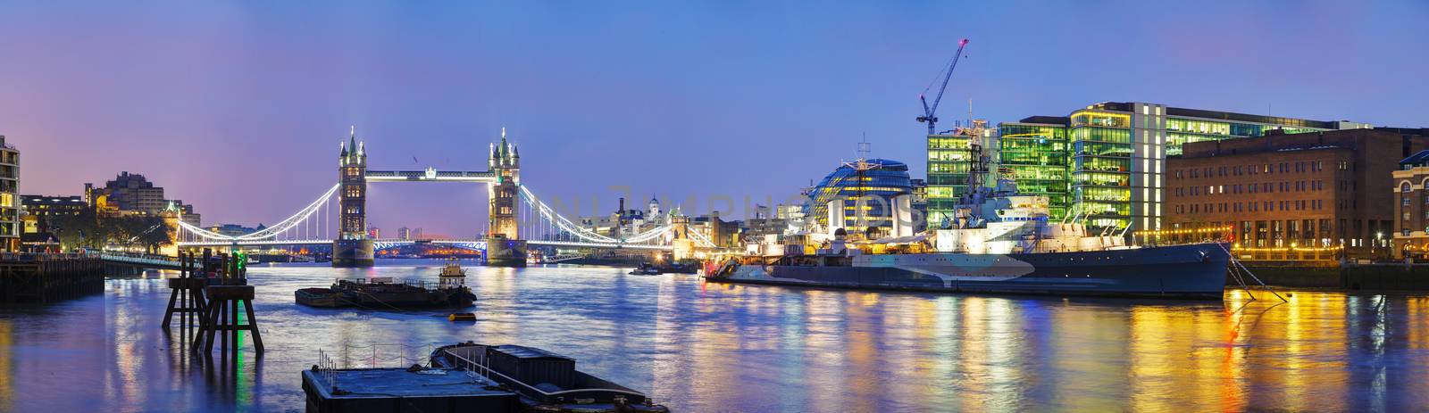 Panoramic overview of Tower bridge in London, Great Britain at night
