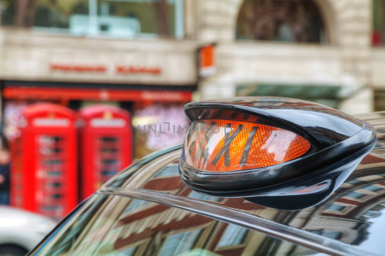 Famous black cab on a street in London by AndreyKr