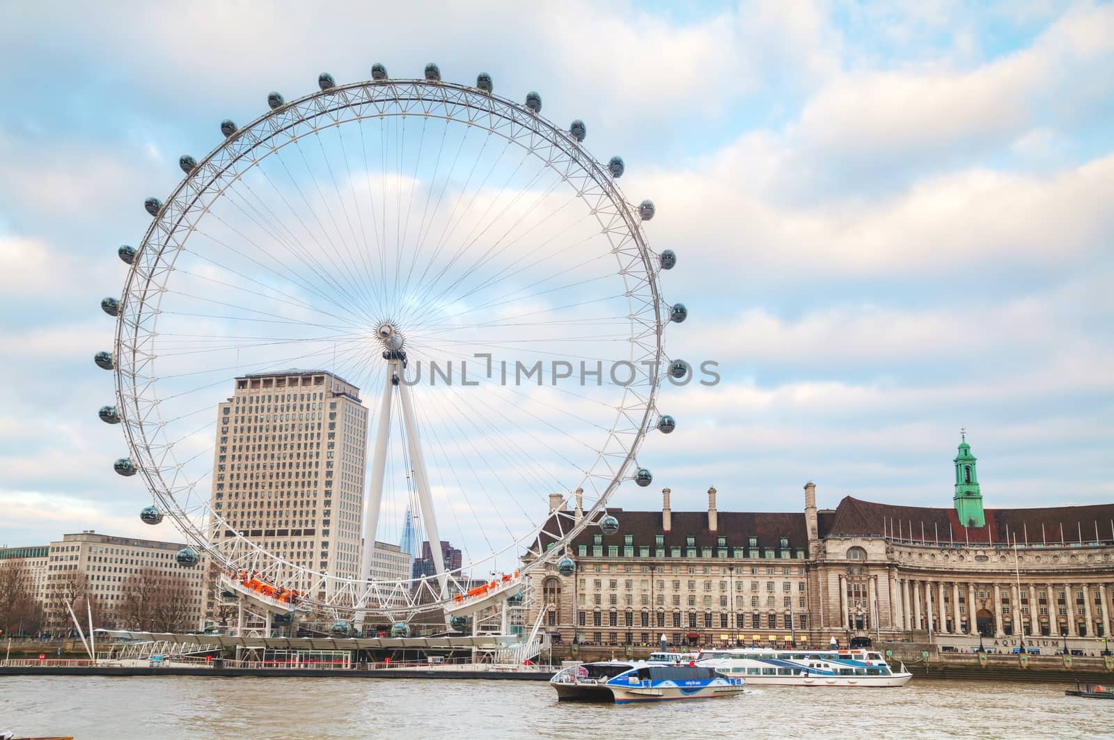 LONDON - APRIL 5: The London Eye Ferris wheel on April 5, 2015 in London, UK. The entire structure is 135 metres tall and the wheel has a diameter of 120 metres.