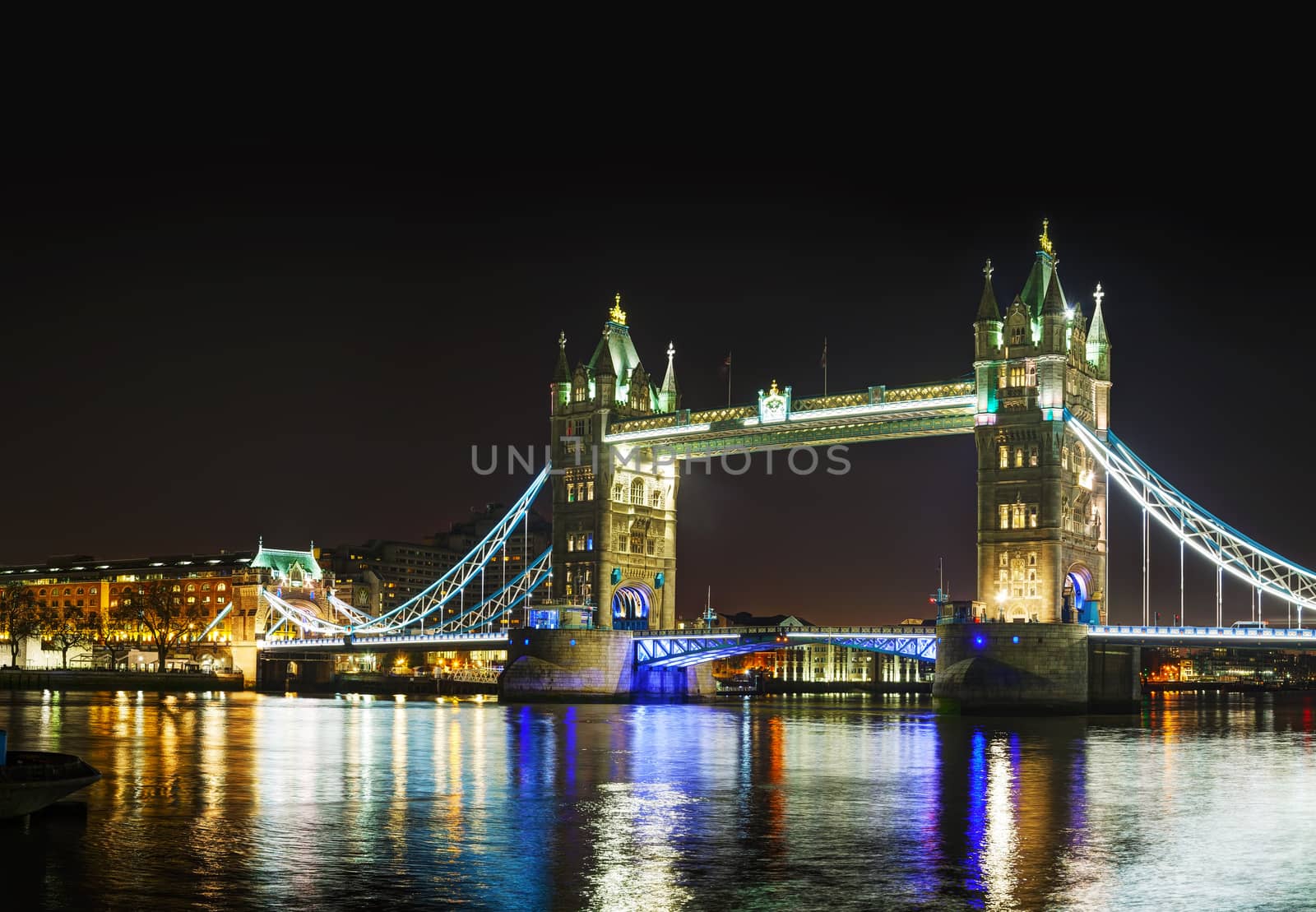 Tower bridge panoramic overview in London, United Kingdom at night