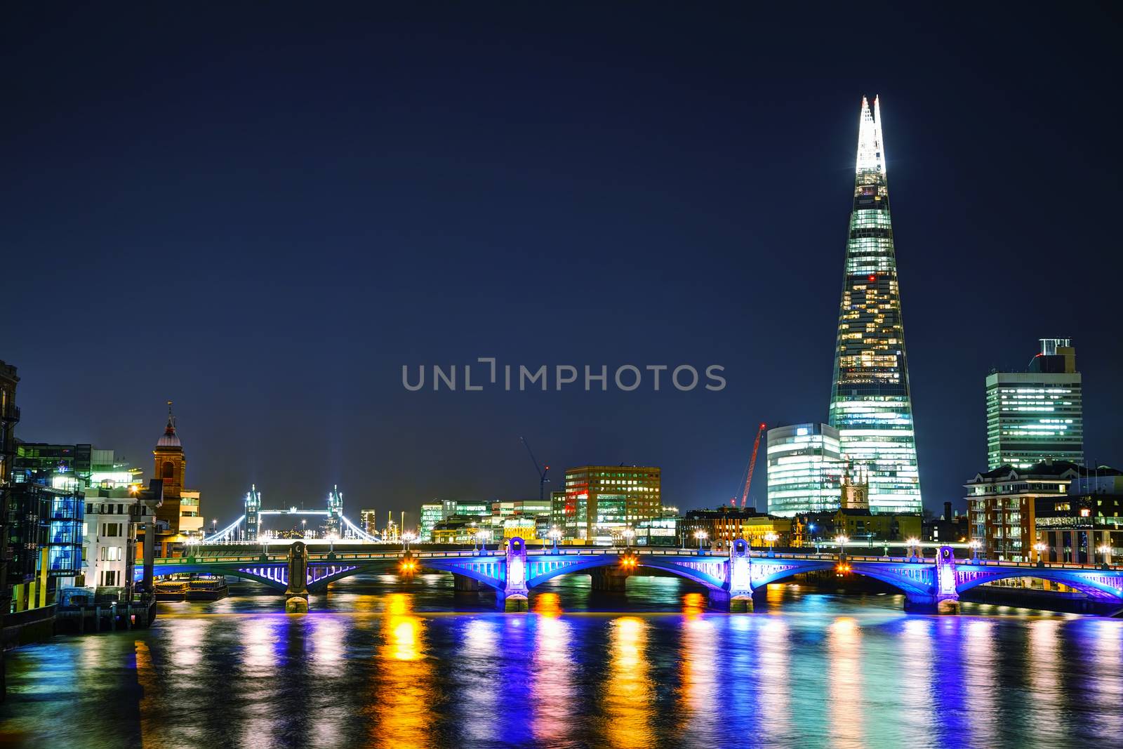 LONDON - APRIL 4: Overview of London with the Shard of Glass on April 4, 2015 in London, UK. Standing 306 metres high, the Shard is currently the tallest building in the European Union.