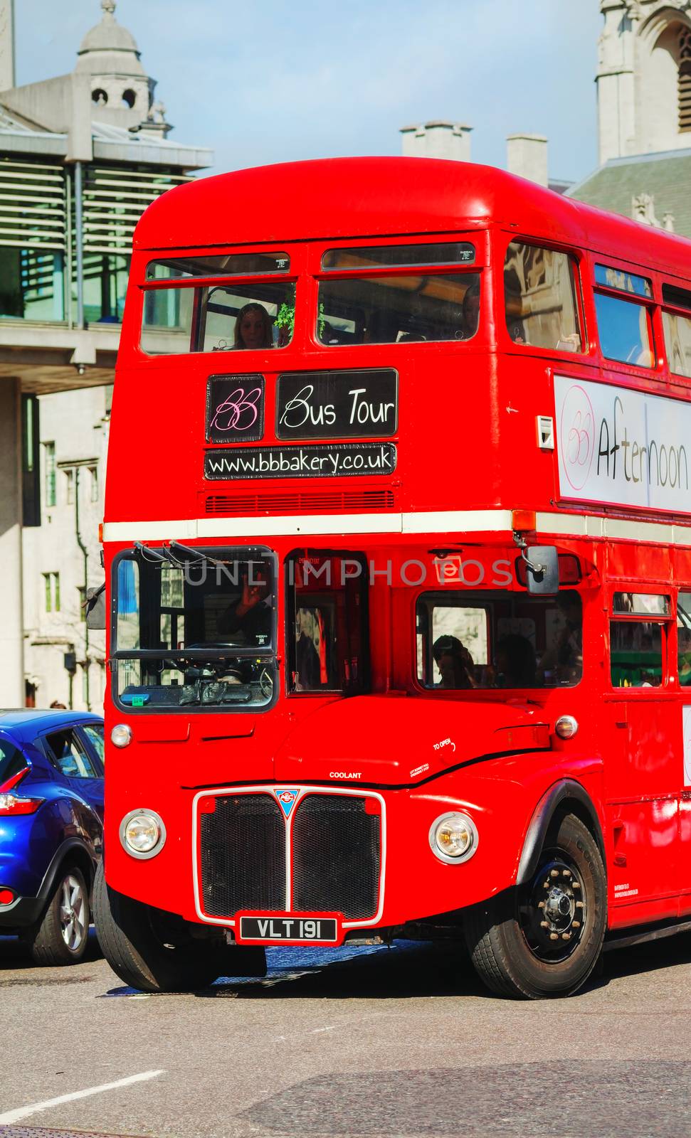 LONDON - APRIL 12: Iconic red double decker bus on April 12, 2015 in London, UK. The London Bus is one of London's principal icons, the archetypal red rear-entrance Routemaster recognised worldwide.