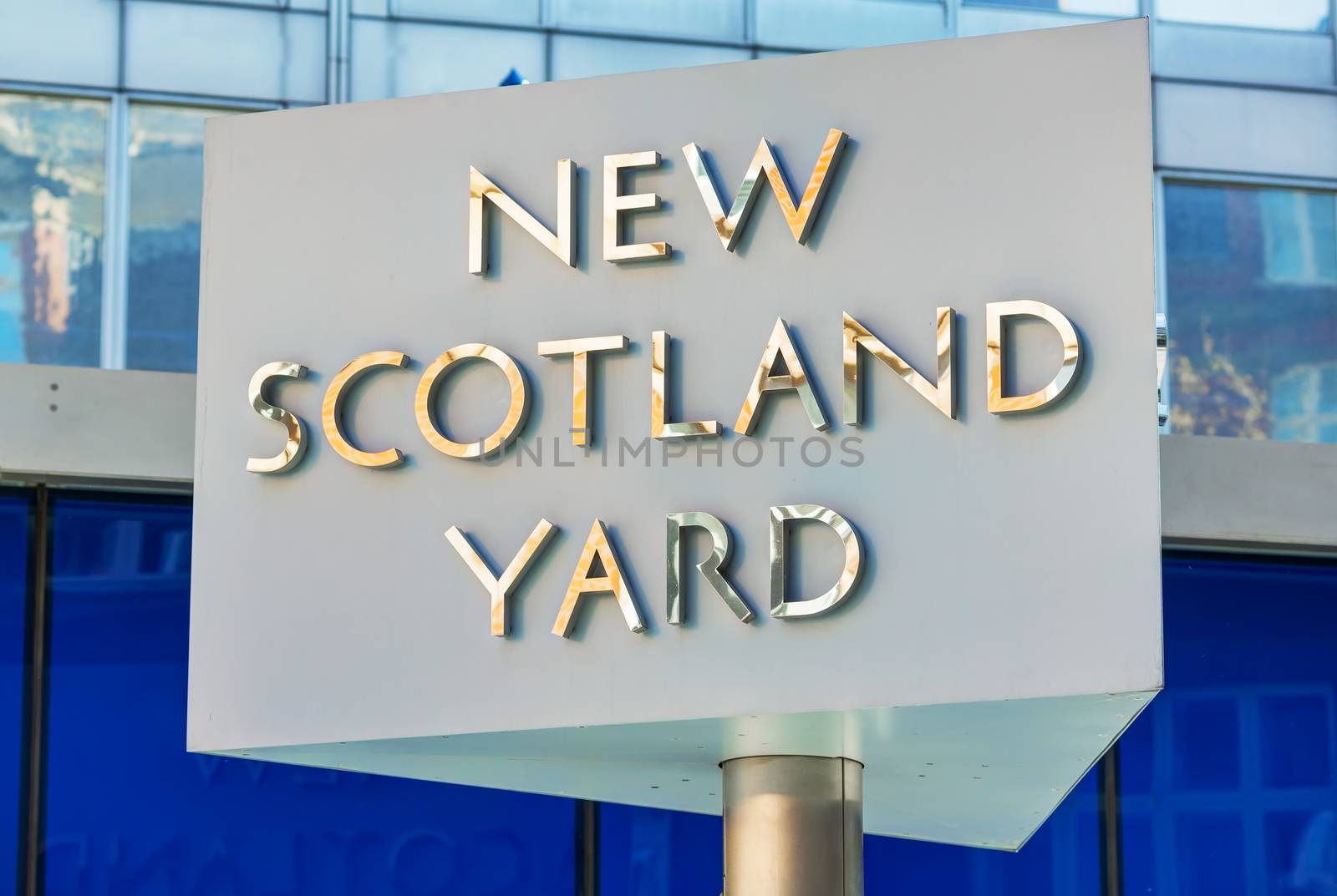 LONDON - APRIL 12: Famous New Scotland Yard sign on April 12, 2015 in London, UK. It's a metonym for the headquarters of the Metropolitan Police Service, the territorial police force of London.