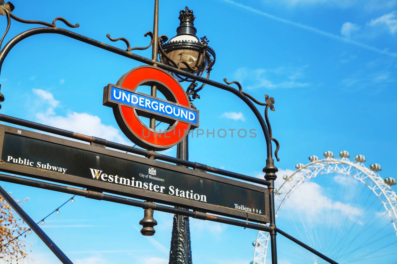 LONDON - APRIL 12: London underground sign at the Westminster station on April 12, 2015 in London, UK. The system serves 270 stations and has 402 kilometres of track, 52% of which is above ground.