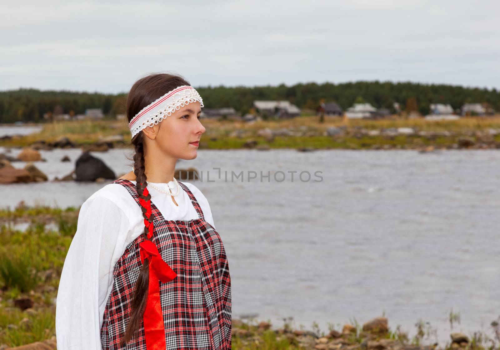 Pomorian girl in national dress is waiting for the return of the groom from the voyage