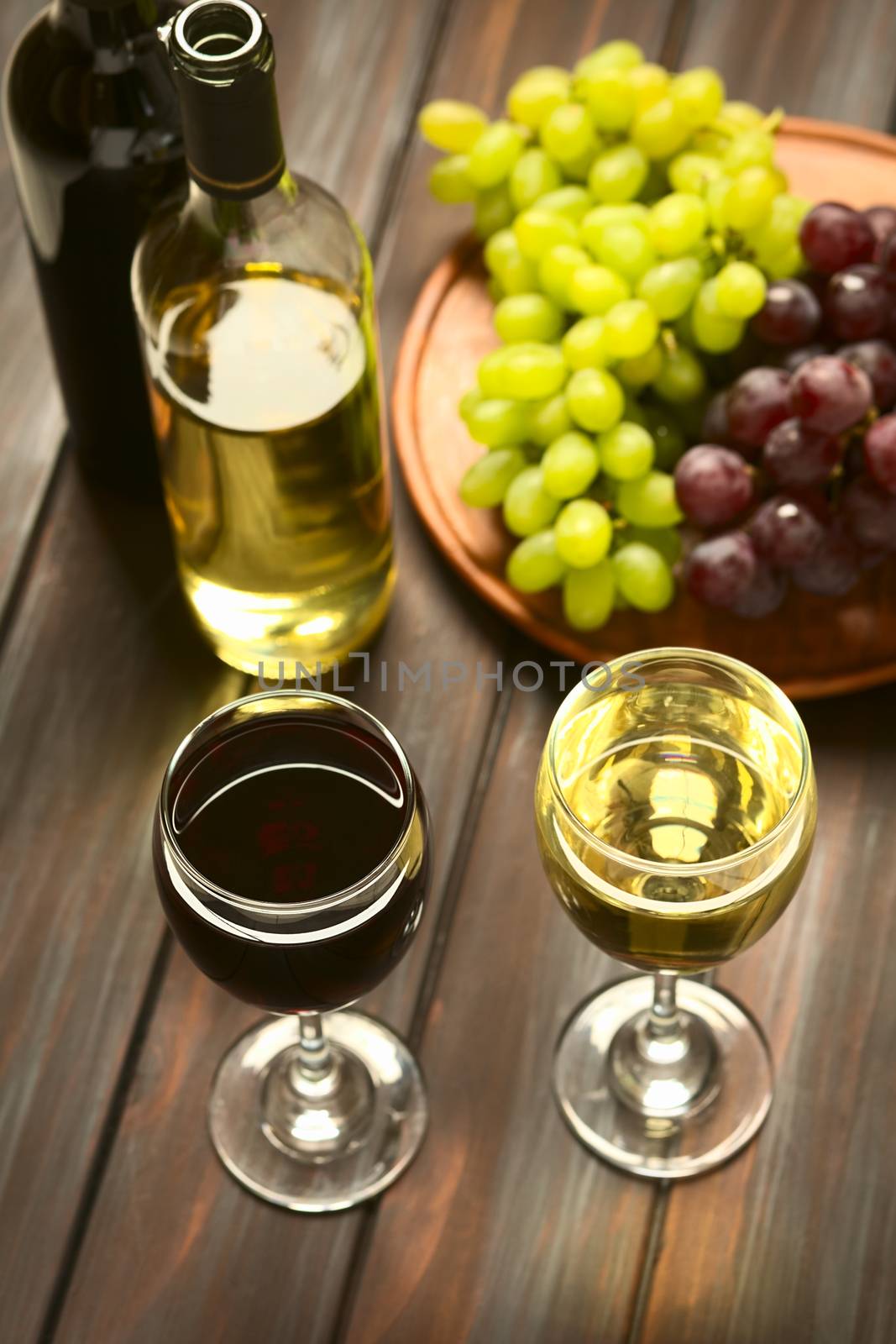 Glasses of Red and White Wine by ildi