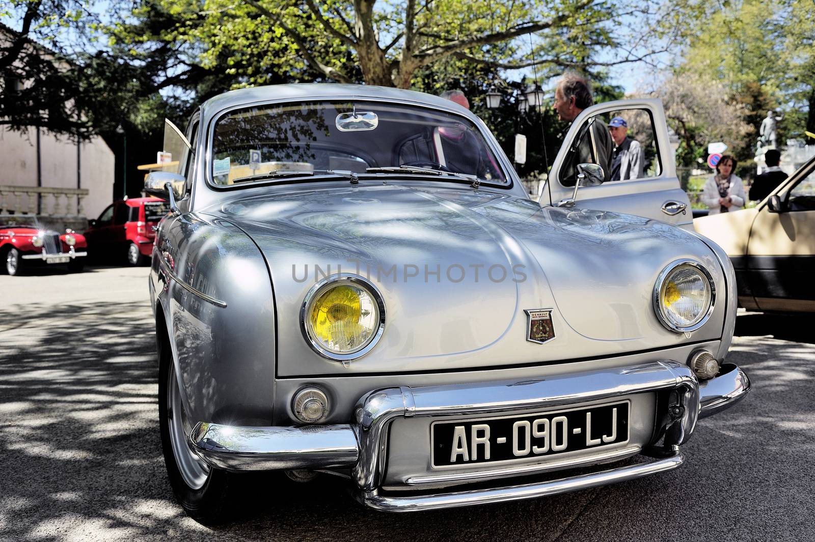 Renault Dauphine Gordini gray photographed vintage car rally in the square of the Town Hall of the city of Ales in the Gard department.