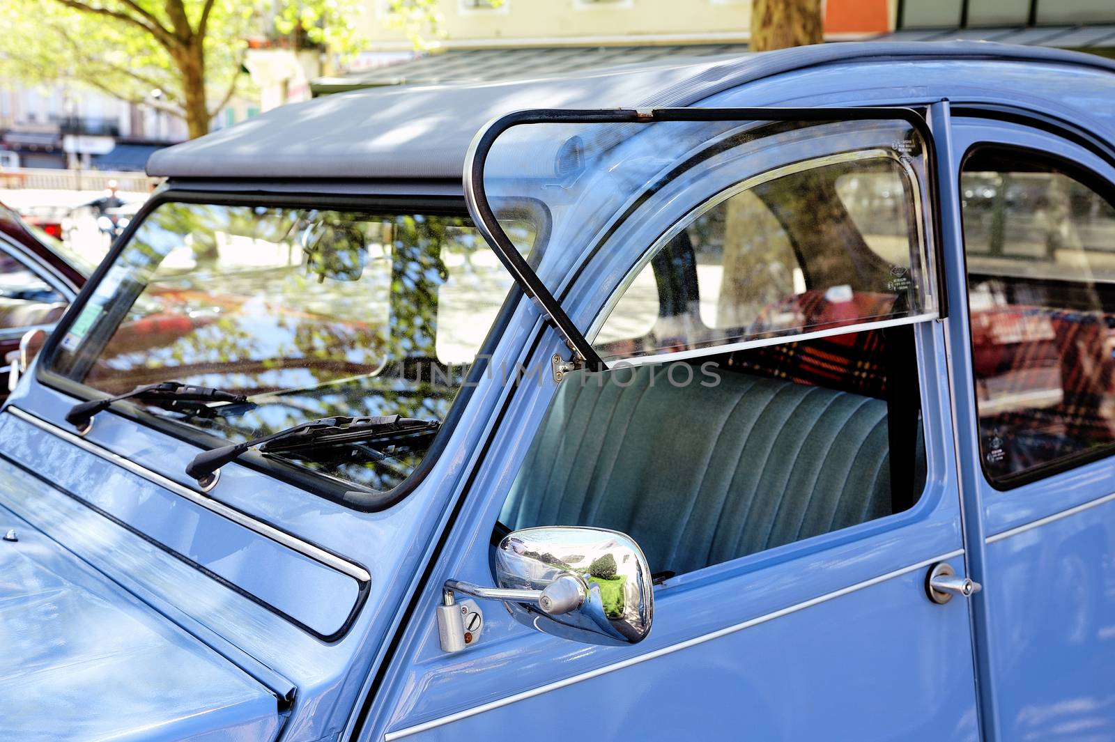 Citroen 2CV blue photographed in vintage car rally on City Hall Square in the city of Ales in the Gard department