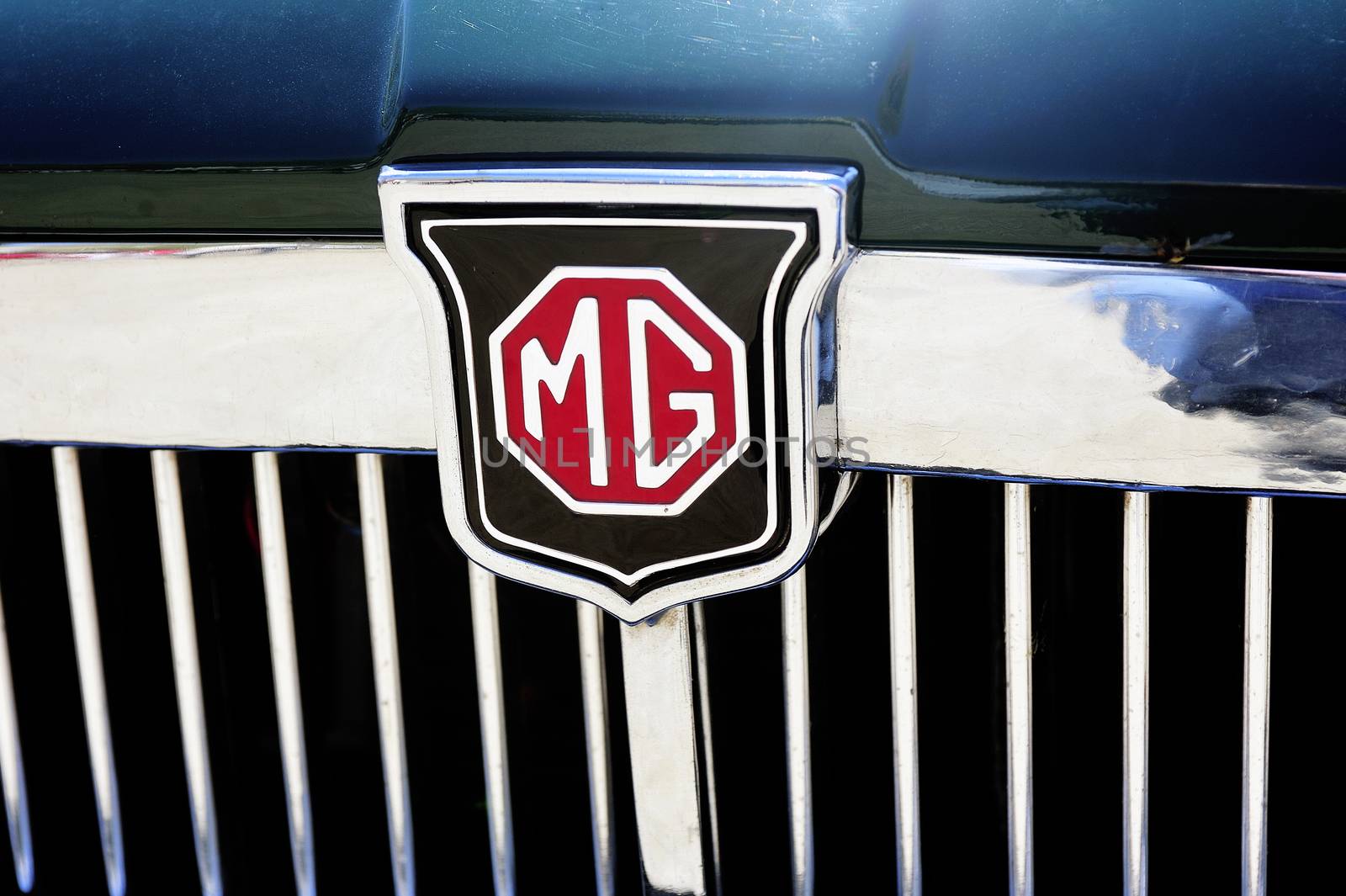 Detail of the MG brand on an old car radiator photographed vintage car rally Town Hall Square in the town of Ales, in the Gard department