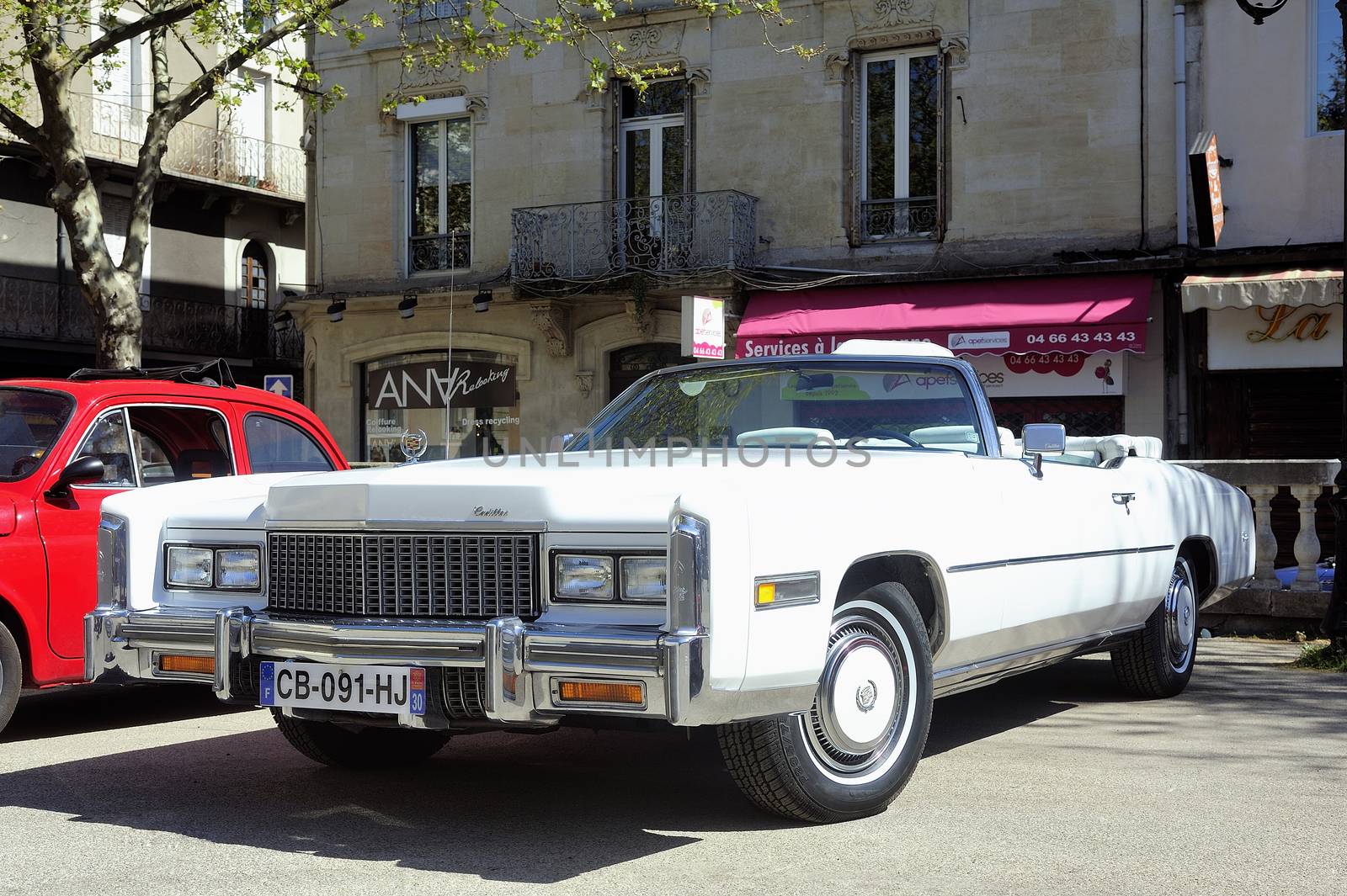 before a white Cadillac Eldorado 1970 by gillespaire