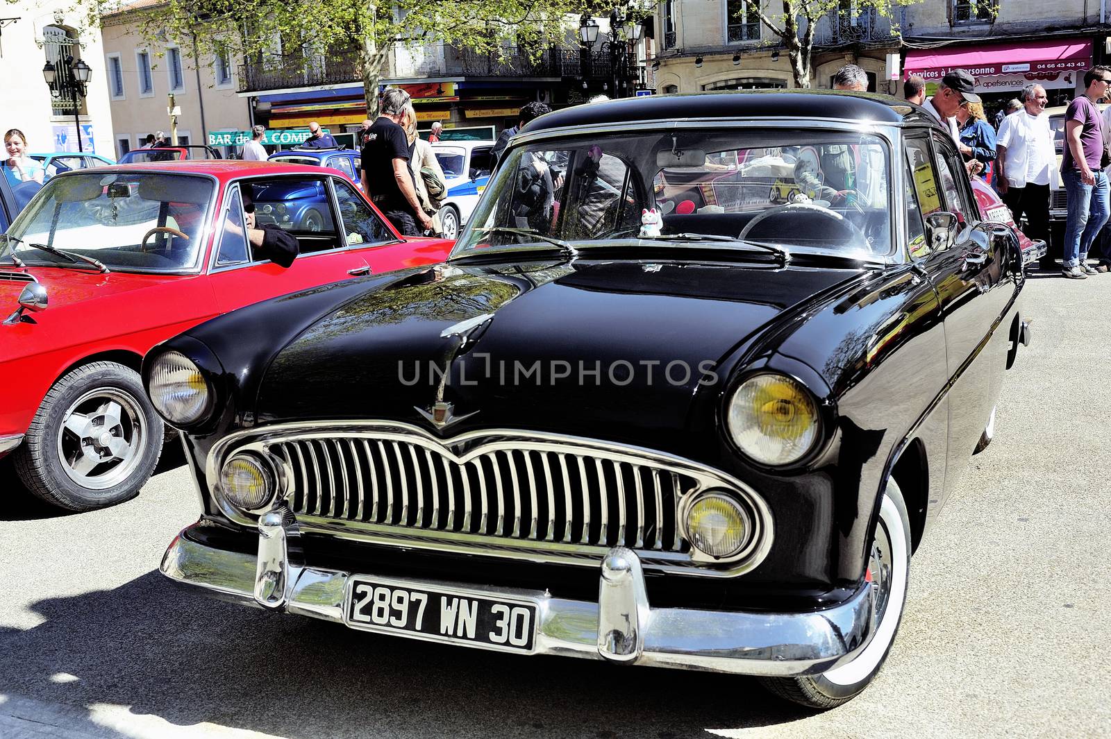 Simca Chambord black manufactured between 1958 and 1961 photographed vintage car rally in the square of the Town Hall of the city of Ales