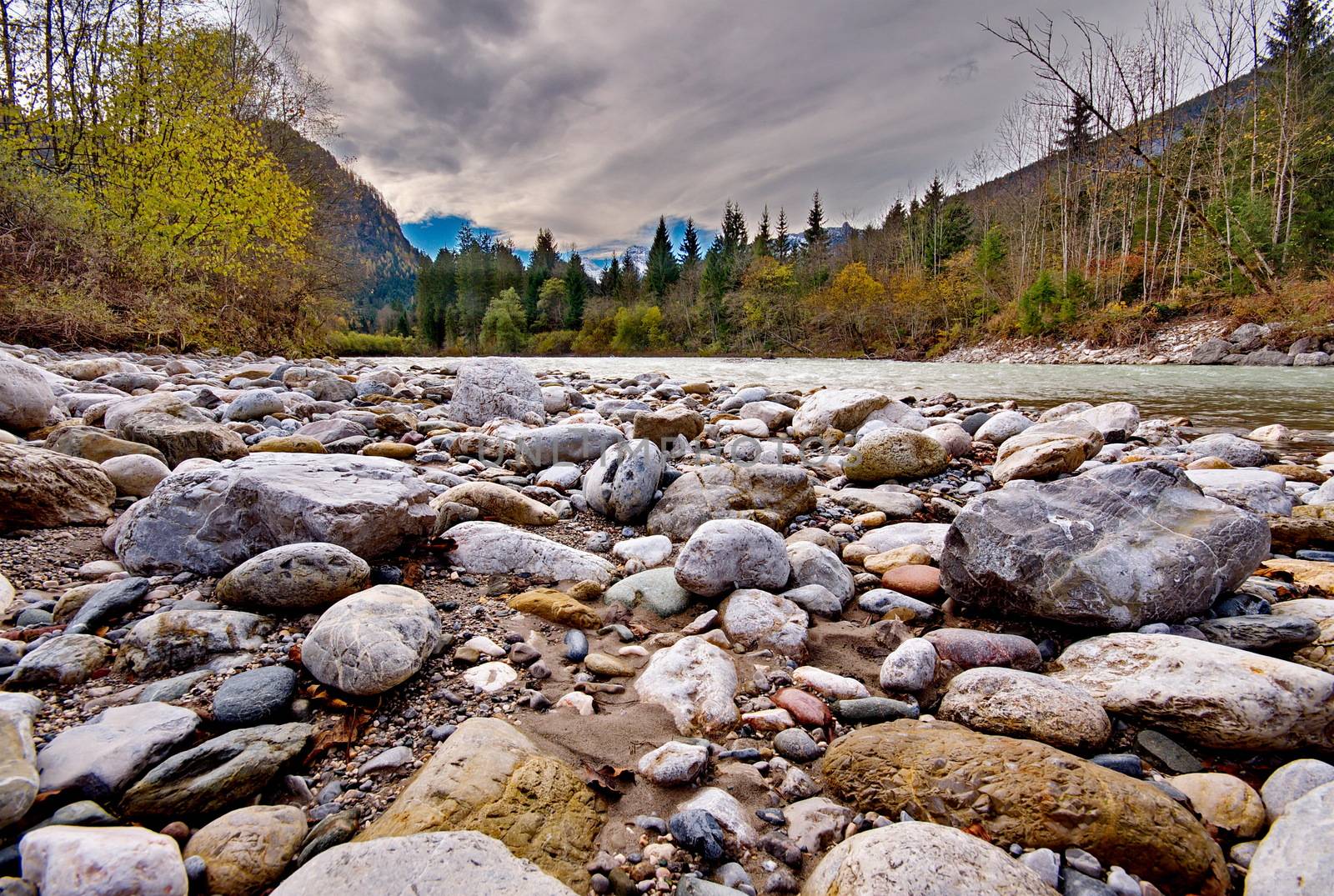 Rocks in the flowing river at the mountains