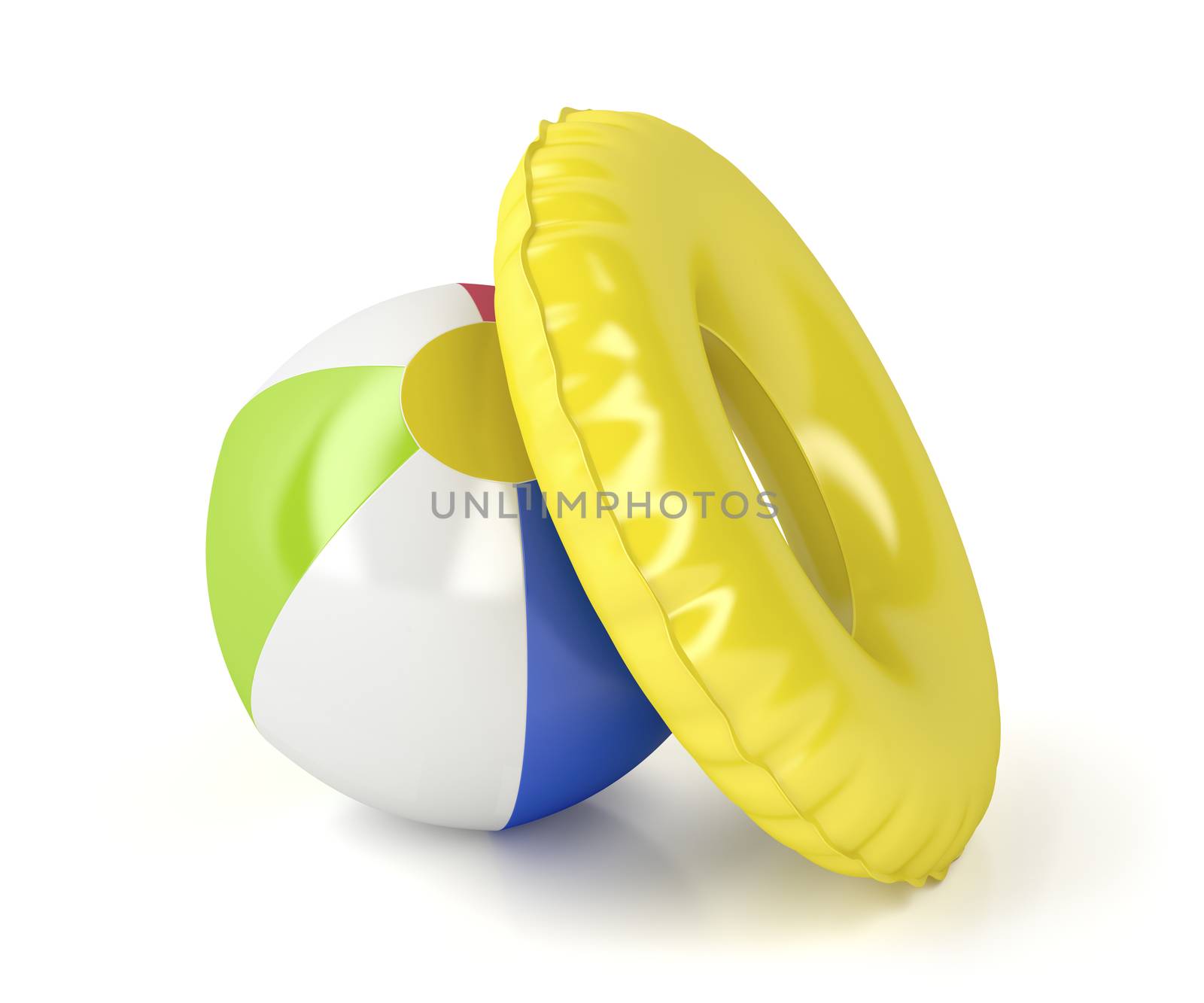 Beach ball and swim ring on white background