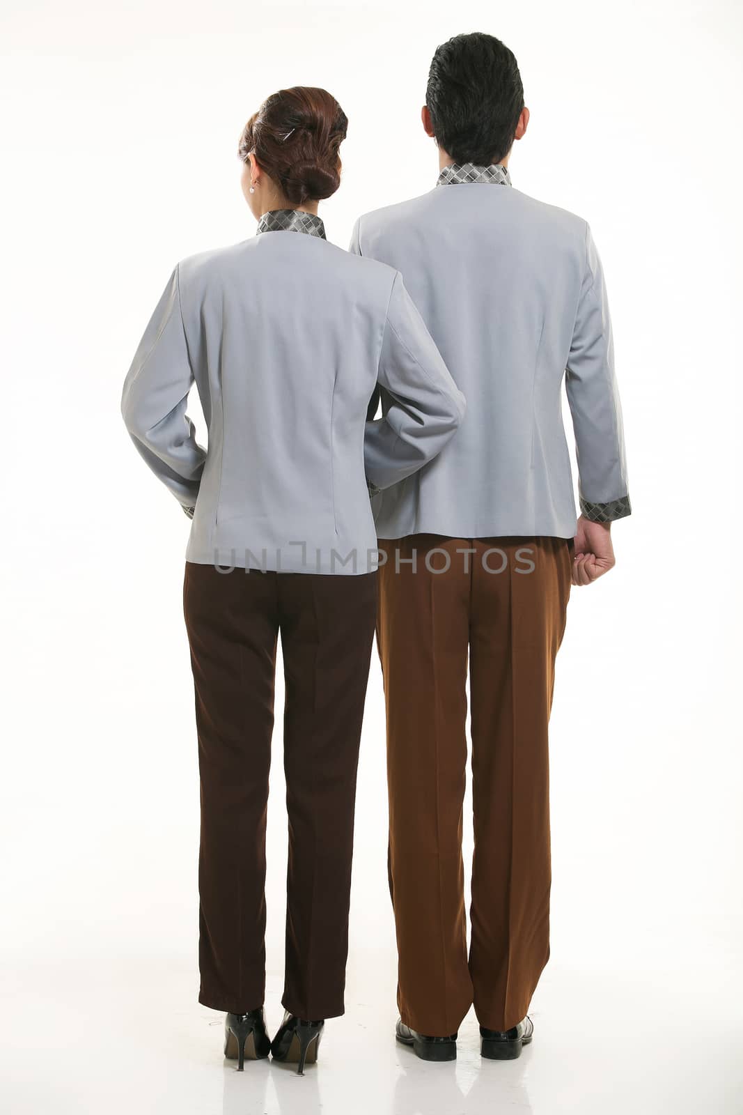 dressed in overalls who stand in front of a white background