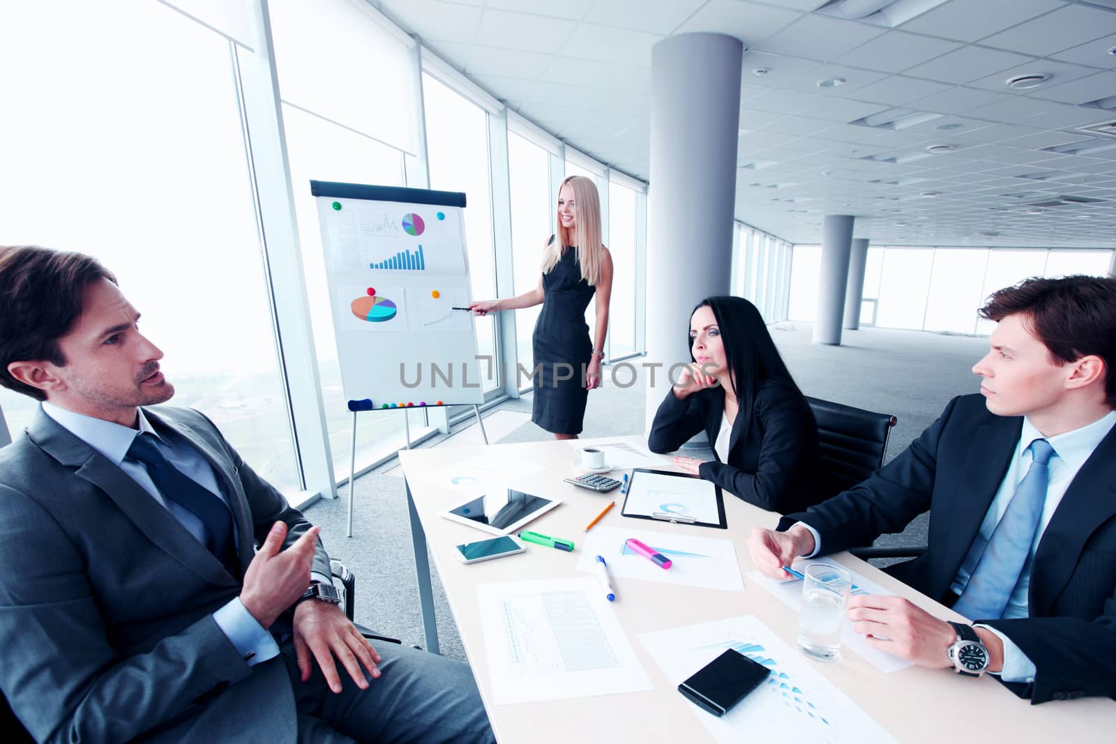 businesswoman showing data on whiteboard