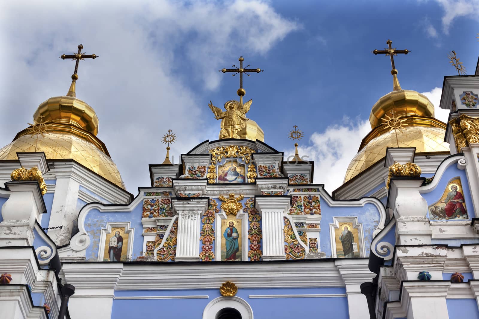 Saint Michael Monastery Cathedral Steeples Spires Facade Kiev Ukraine.  Saint Michael's is a functioning Greek Orthordox Monasatery in Kiev.  The original monastery was created in the 1100s but was destroyed by the Soviet Union in the 1930s.  St. Michaels was reconstructed after Ukrainian independencein 1991 and reopened in 1999.