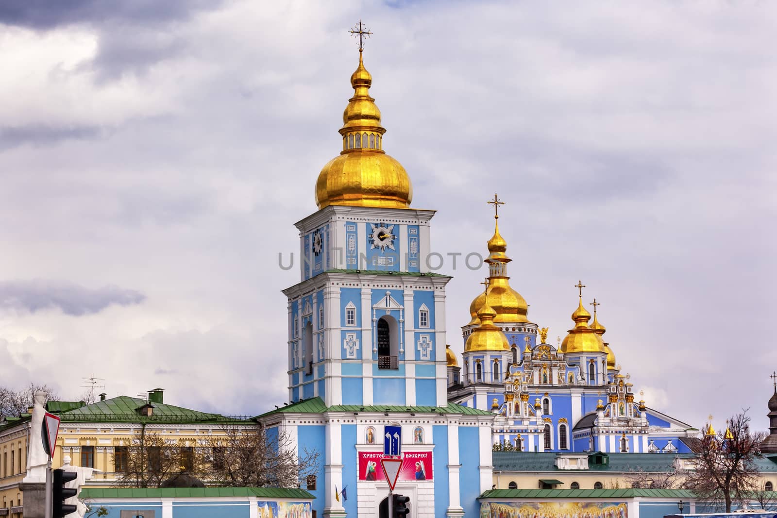 Saint Michael Monastery Cathedral Steeples Spires Tower Golden Dome Facade Kiev Ukraine.  Saint Michael's is a functioning Greek Orthordox Monasatery in Kiev.  The original monastery was created in the 1100s but was destroyed by the Soviet Union in the 1930s.  St. Michaels was reconstructed after Ukrainian independencein 1991 and reopened in 1999.