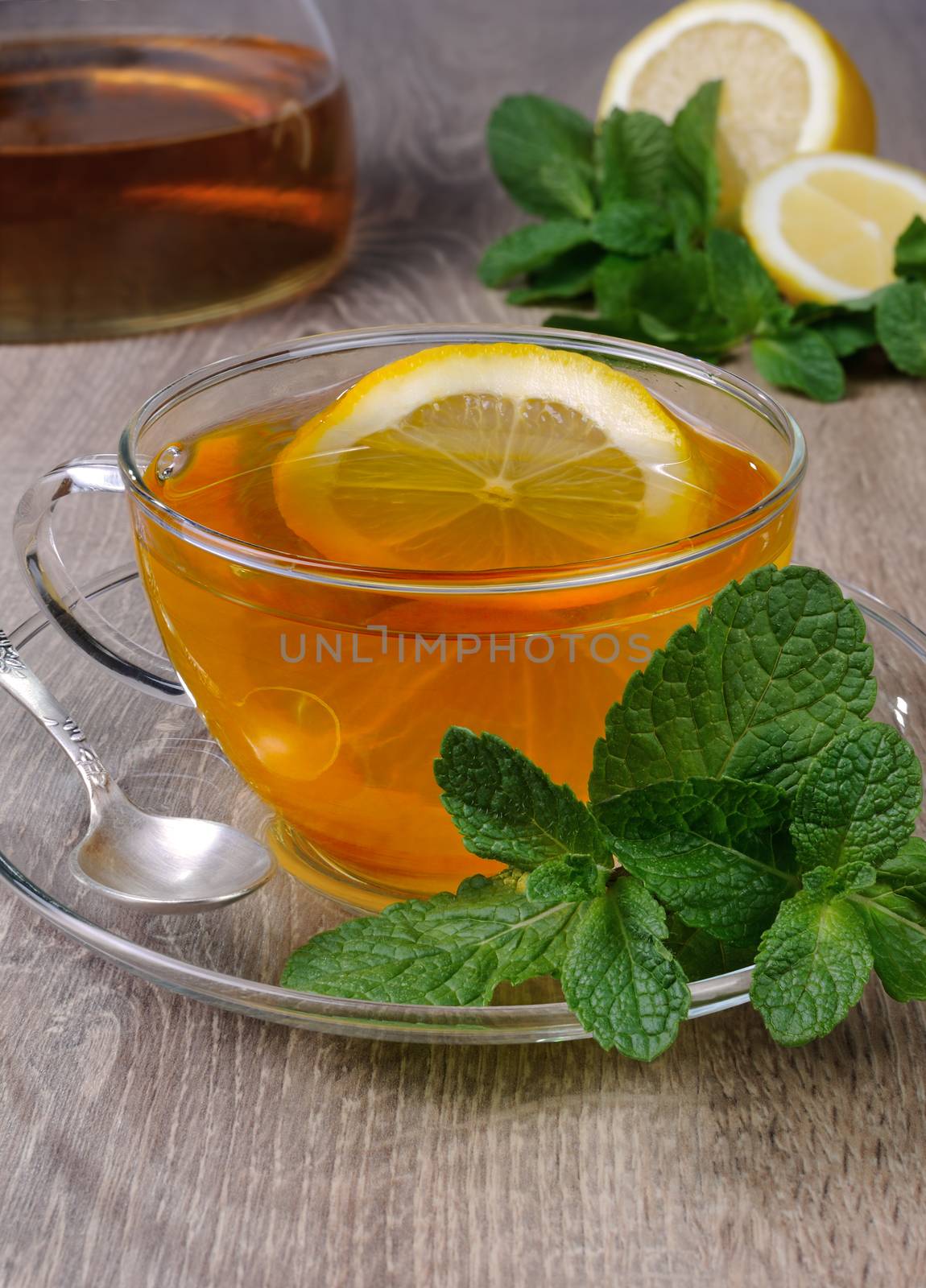 Cup of tea with a slice of lemon and  mint