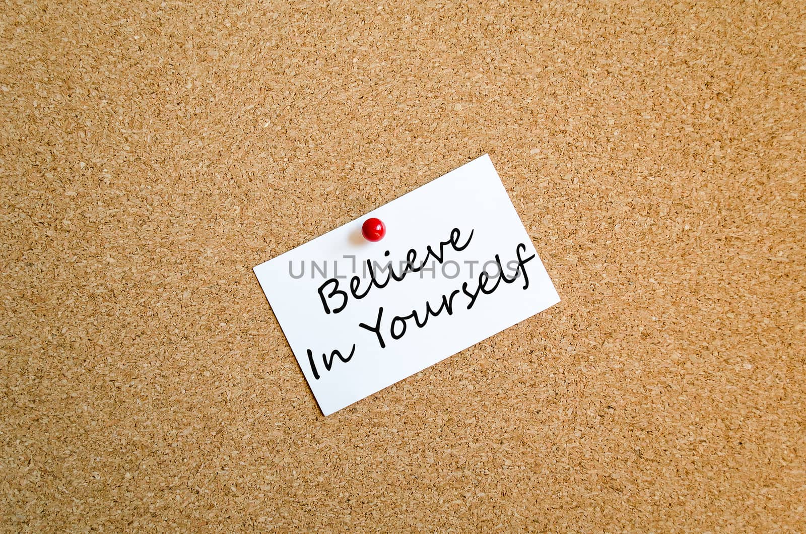 Sticky Note On Cork Board Background Believe in yourself concept