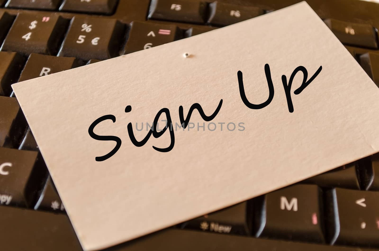 Sign up Concept on black keyboard note