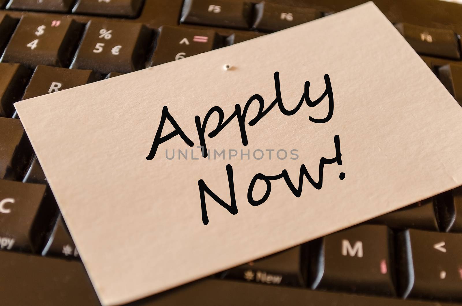 Apply Now Concept on black keyboard