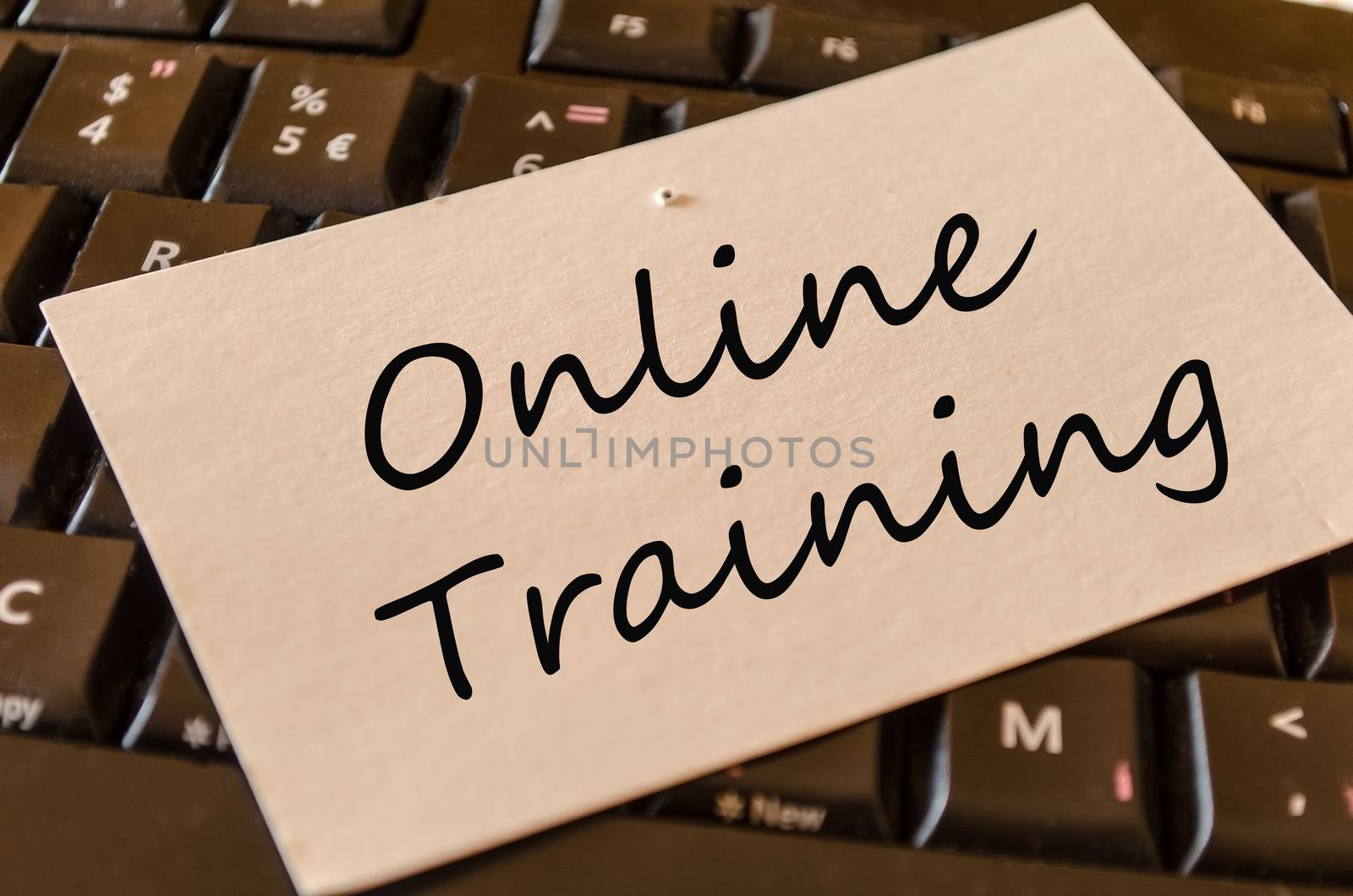 Online training Concept on black keyboard