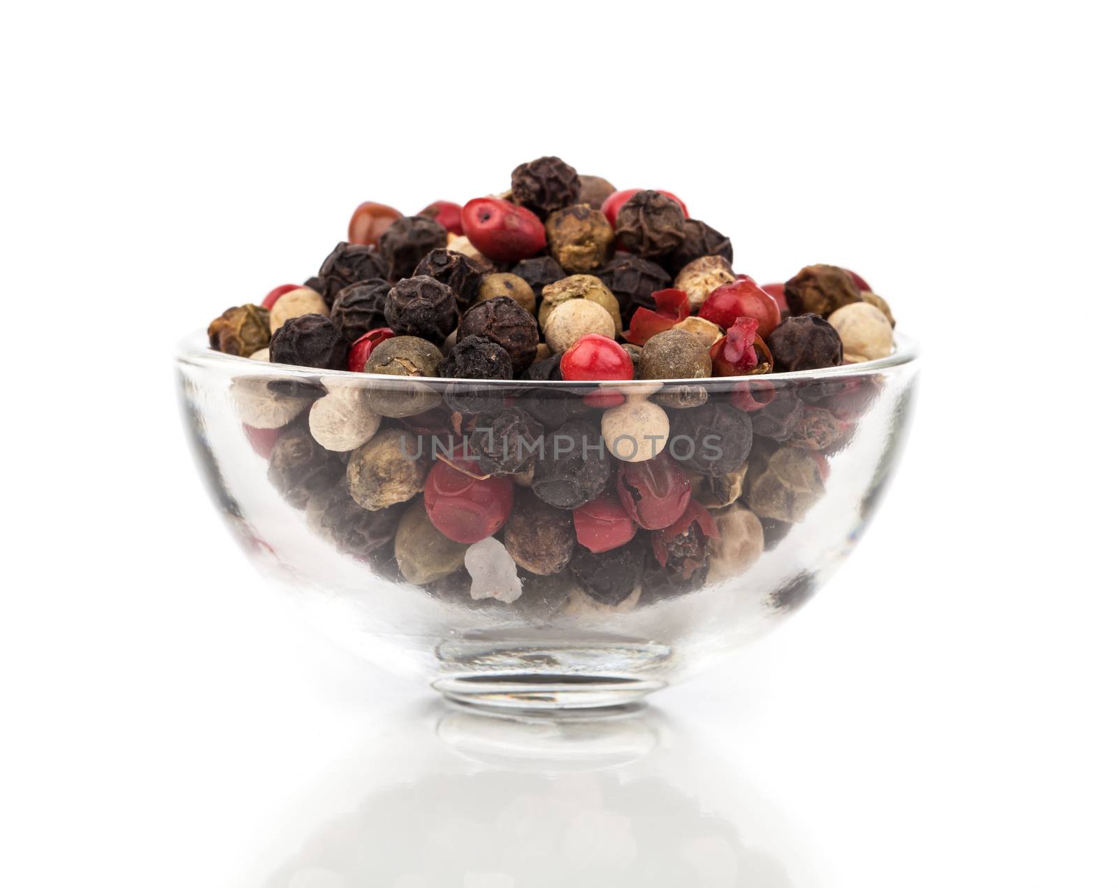 Colored Pepper in a glass bowl isolated on white background by motorolka