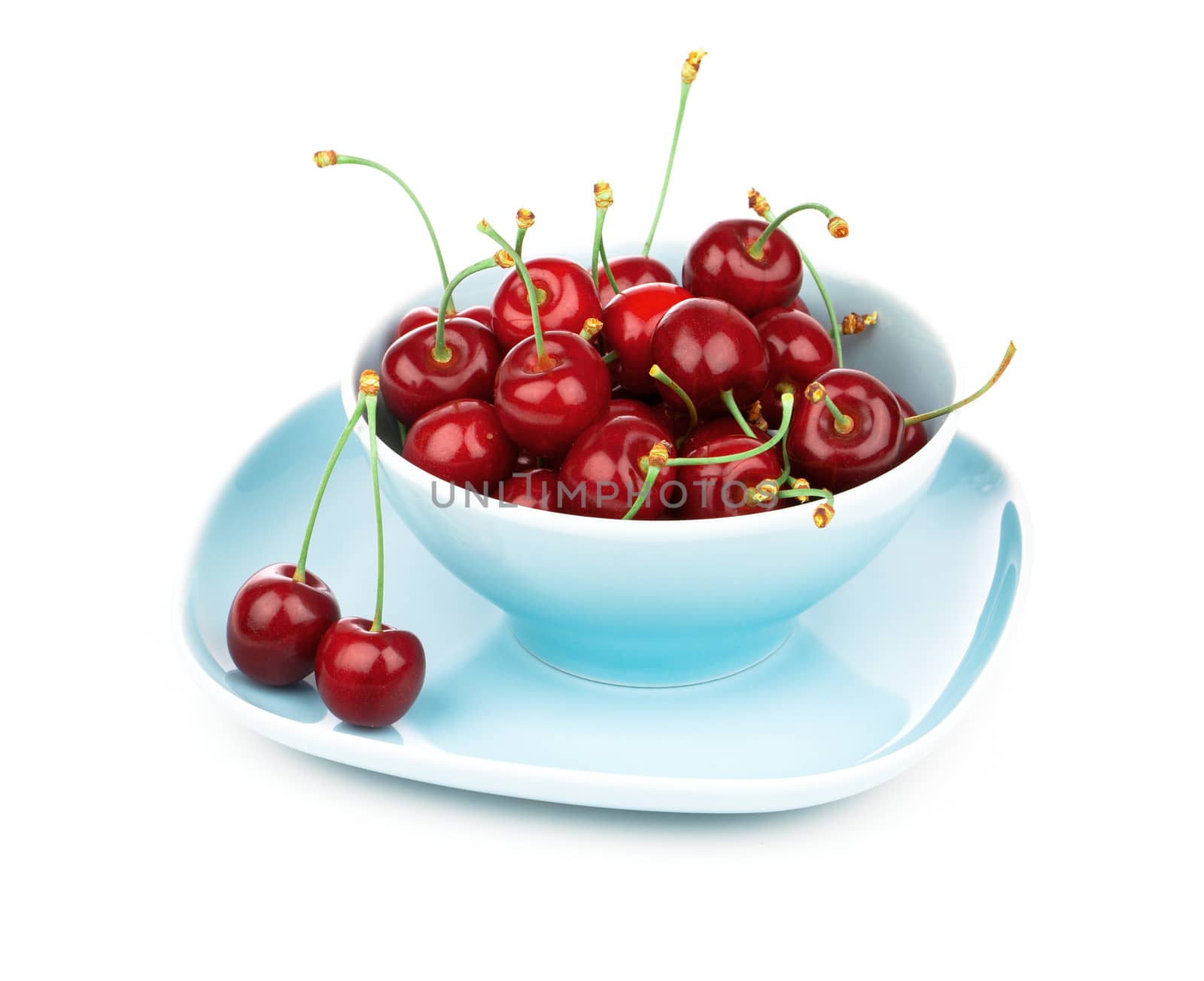 Bowl full of cherries isolated on white background by motorolka