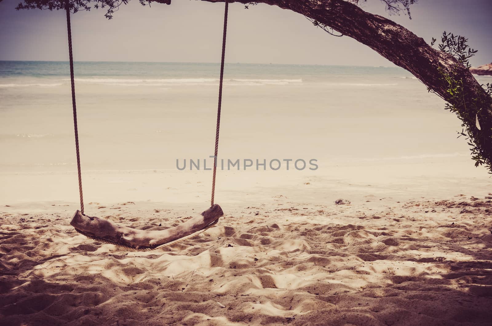 swing on beach sand and sea in Koh Samet Thailand vintage